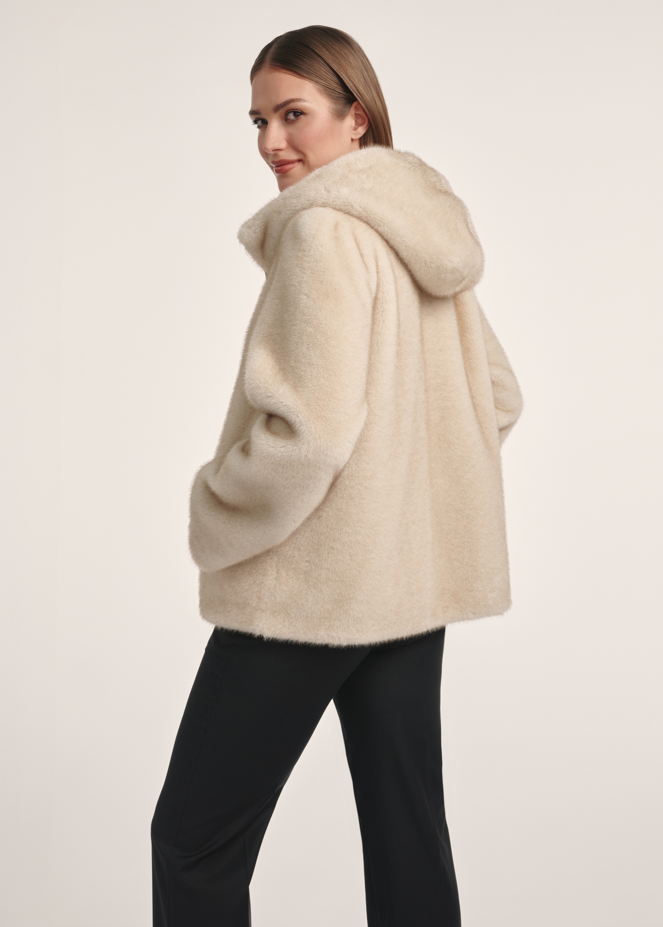 Beige women's fur coat with zipper FUTDP-0057-80(Z25), product view from the back on the model, half of the silhouette visible.
