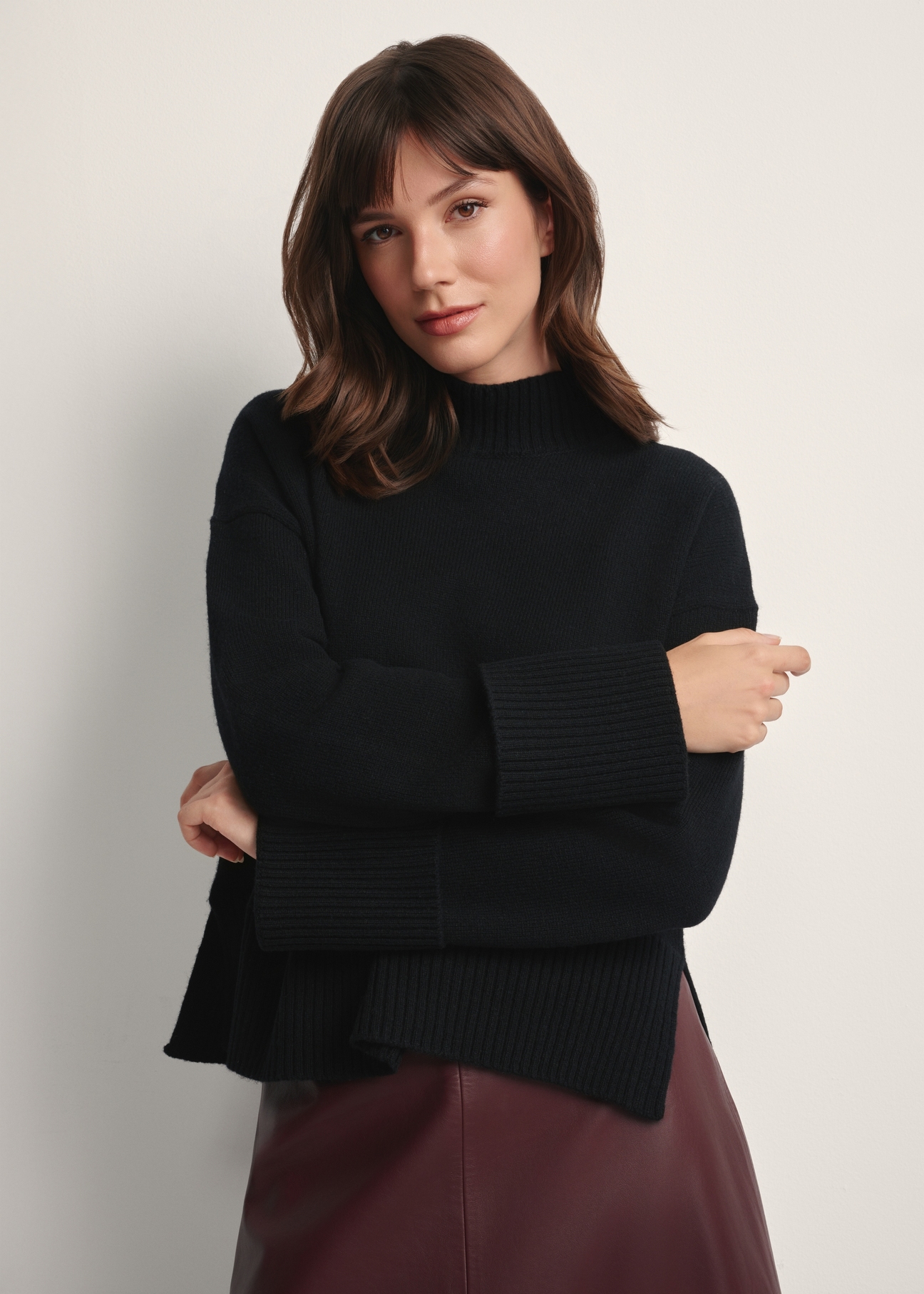 Women's black wool sweater SWEDT-0244-99(Z25), front view of the product on the model. Half of the silhouette visible.