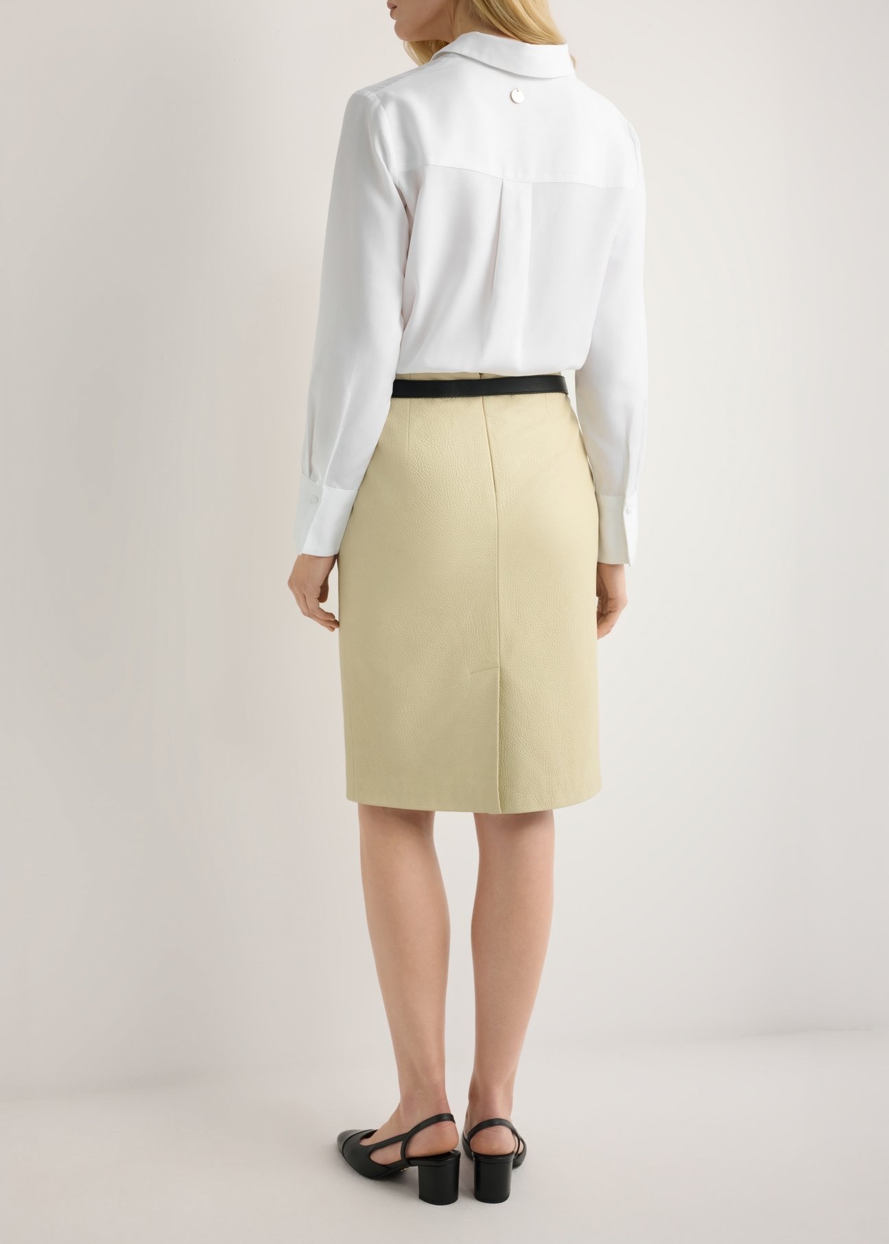 Yellow leather skirt SPCDS-0031-2A(W26), back view of the product on the model. Half of the silhouette visible.