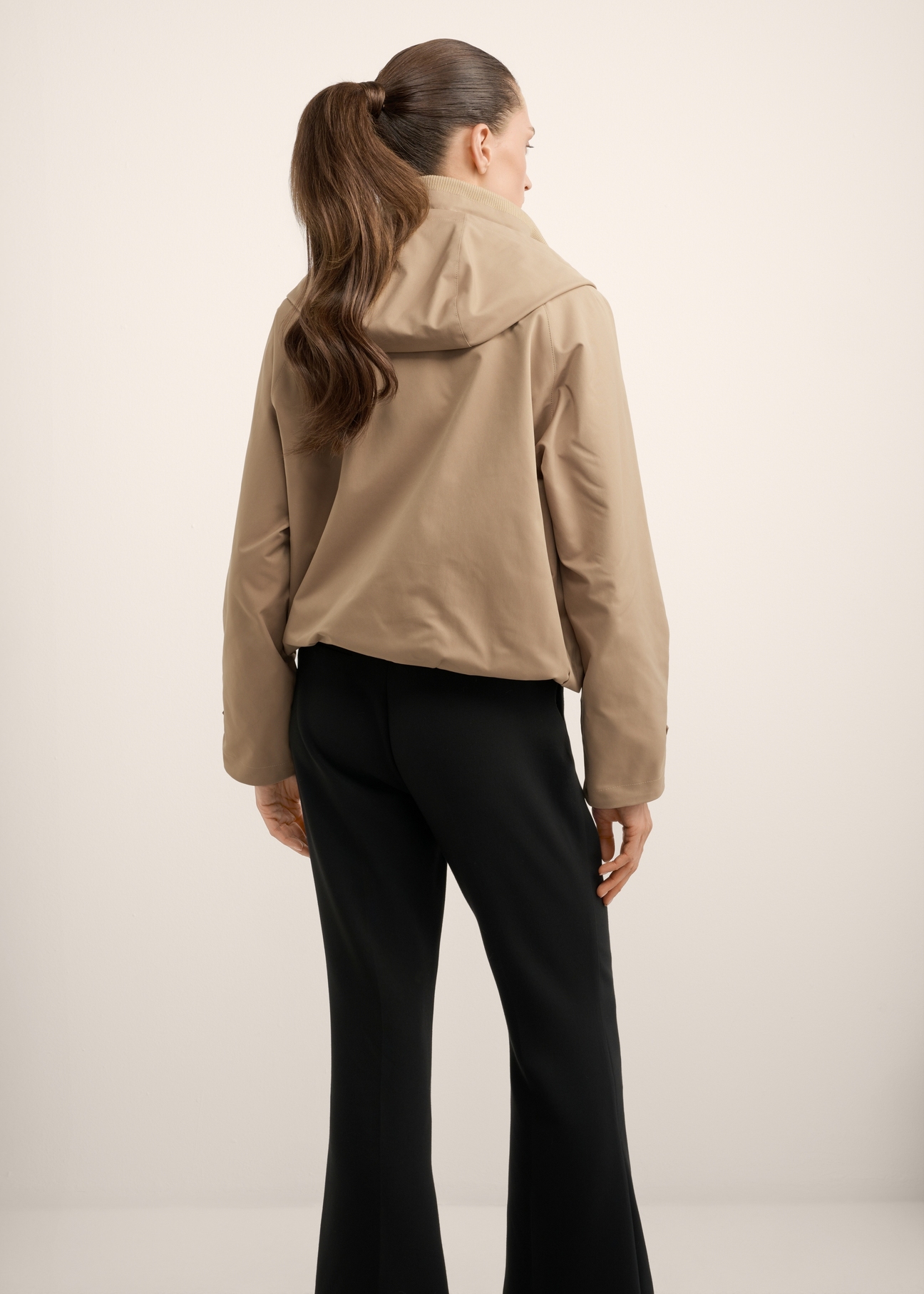 Beige women's transitional jacket KURDT-0644-1D(Z26), back view of the product on the model. Full body visible.