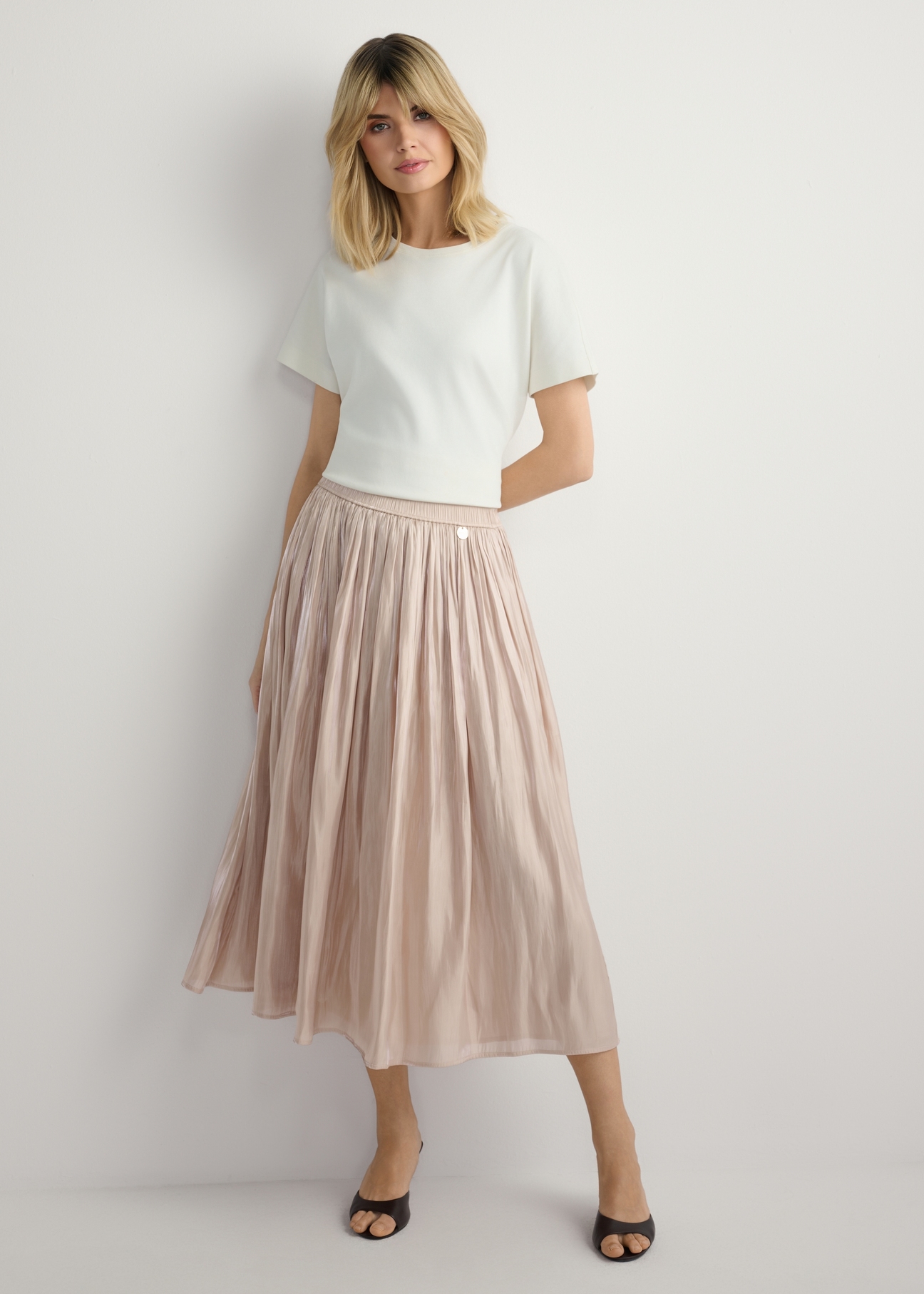 Women's shiny midi skirt SPCDT-0130-1B(W26), front view of the product on the model. Full body visible.