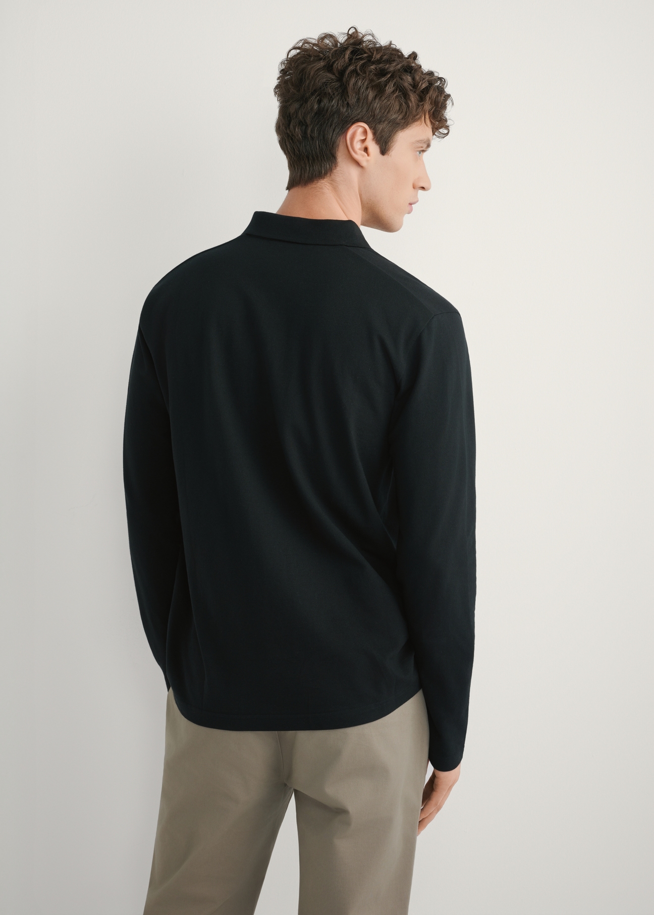 Men's black longsleeve with collar LSLMT-0011-99(W26), back view of the product on the model. Half of the silhouette visible.