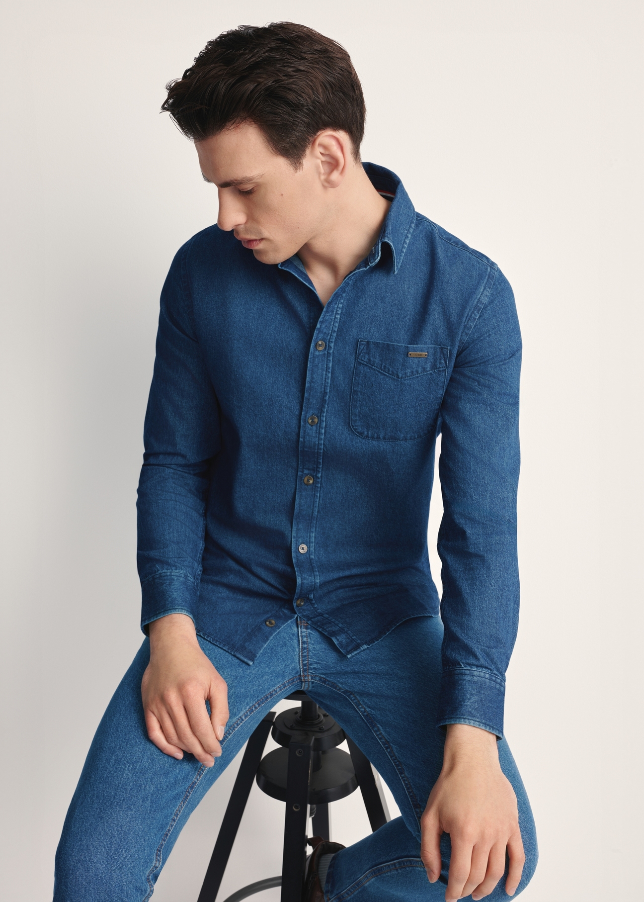 Blue men's denim shirt KOSMT-0348-61(Z25), product visible from the front on the model, half of the silhouette visible.