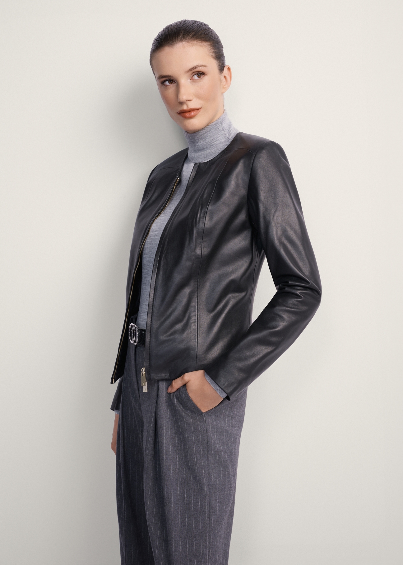 Classic women's genuine leather jacket KURDS-0209-1339(KS), front view of the product on the model. Half of the silhouette visible.