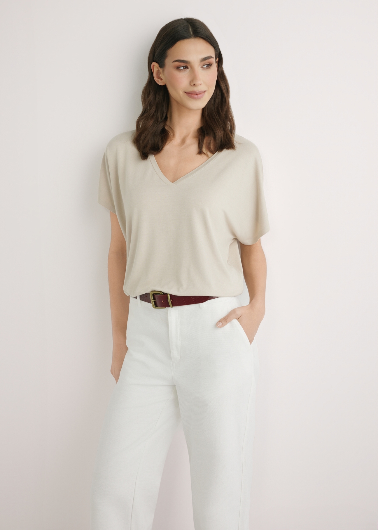 Light beige women's blouse BLUDT-0202-1A(W26), front view of the product on the model. Half of the silhouette visible.