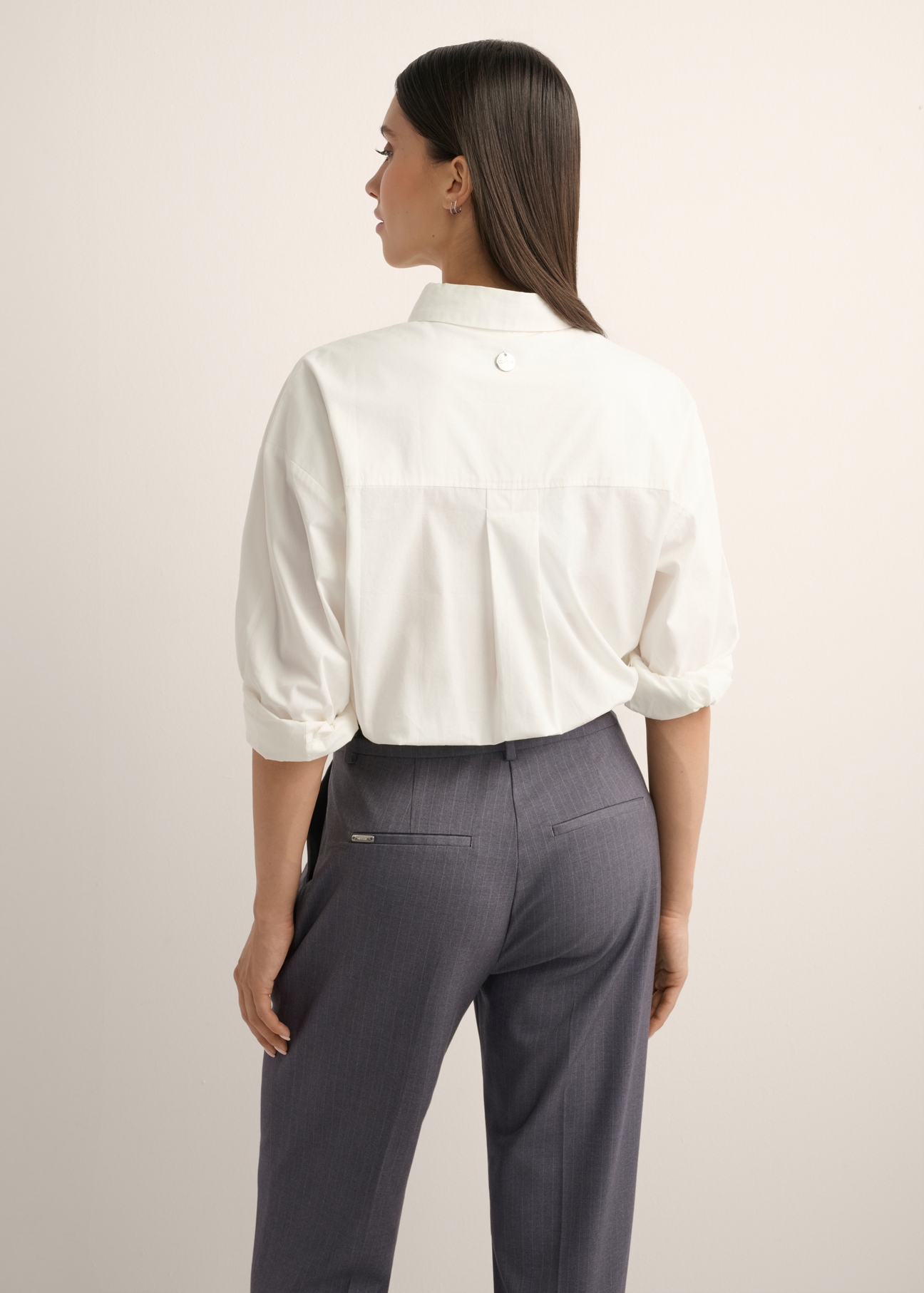Cream oversize women's shirt KOSDT-0193-0C(Z26), product view from the back on the model, half of the silhouette visible.