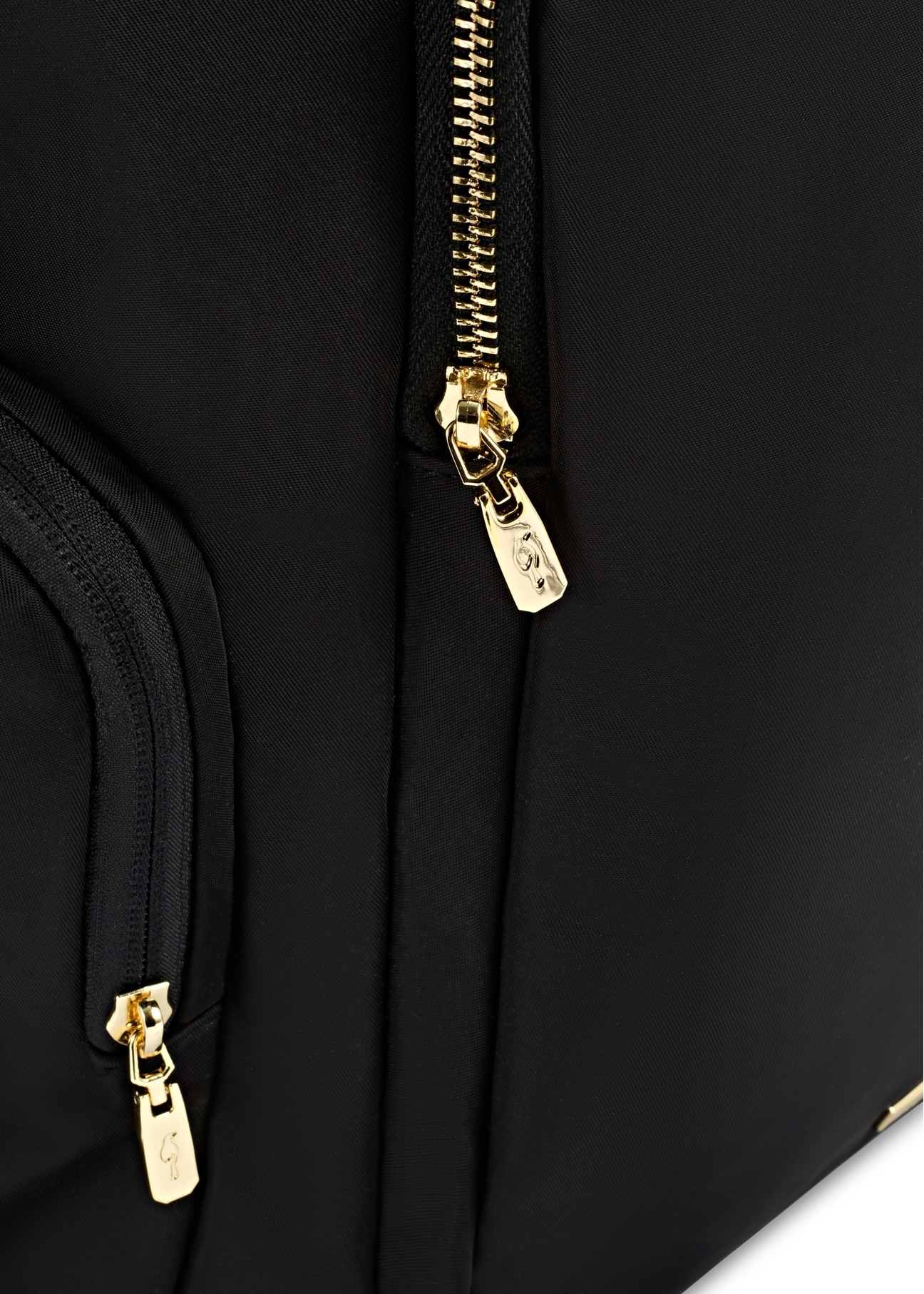 Black large women's backpack TOREN-0321-99(Z25), close-up of the product clasp, view on a white background.