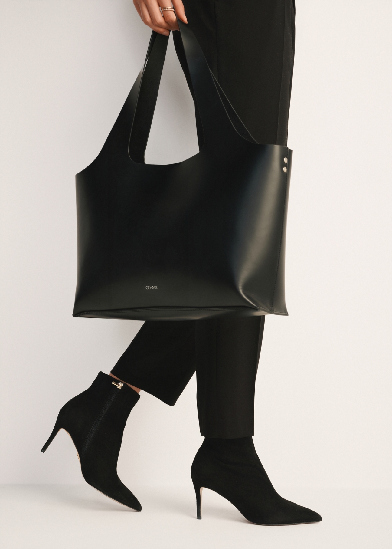 Black suede high heel ankle boots BUTYD-1122-98(Z24), product view on model's feet against a light background.
