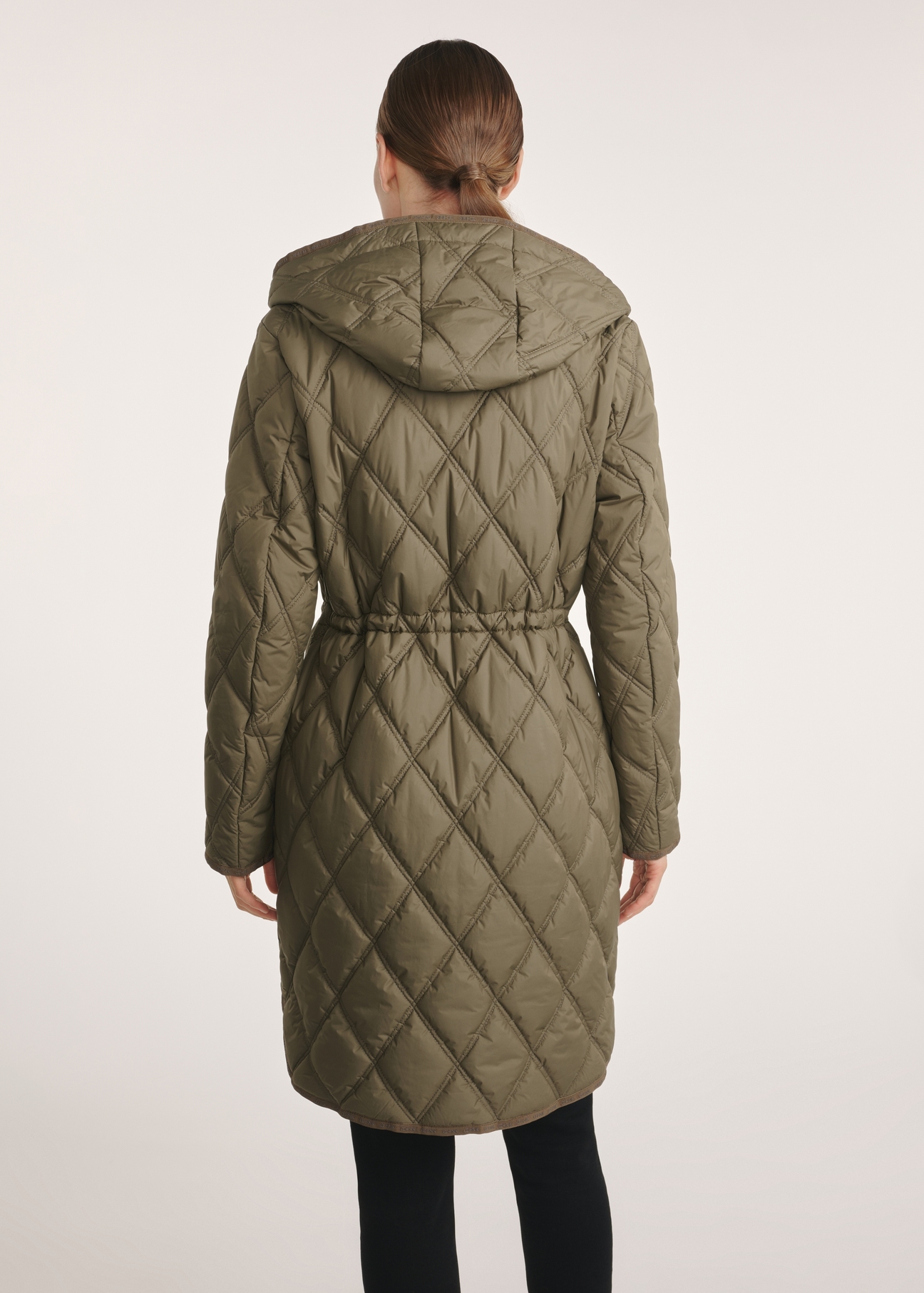 Olive quilted women's jacket KURDT-0579-57(Z25), product view from the back on the model, half of the silhouette visible.