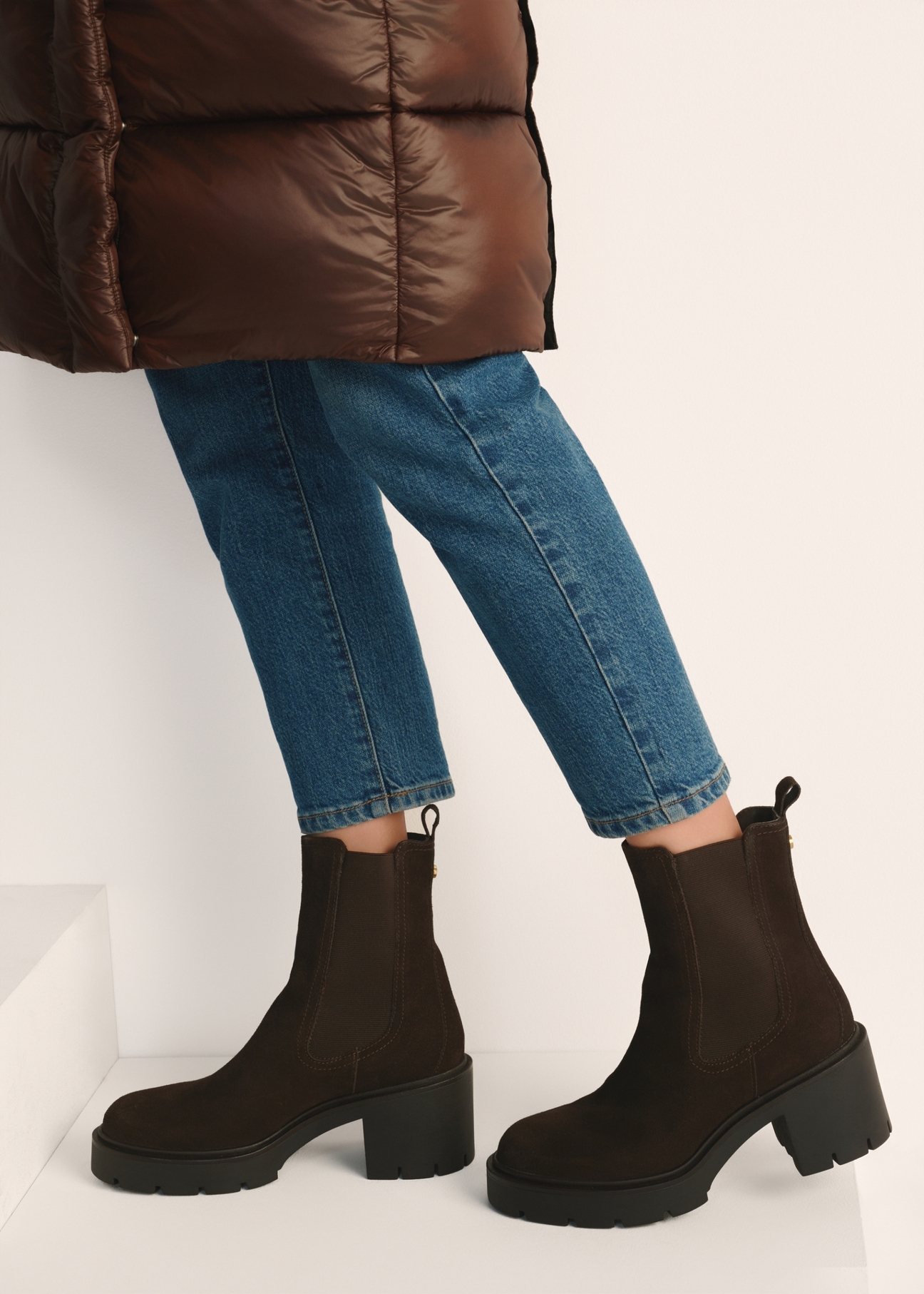 Women's brown suede high-heeled ankle boots BUTYD-1094-89(Z25) - side view of the product on a model against a white background. Knee-length silhouette visible.