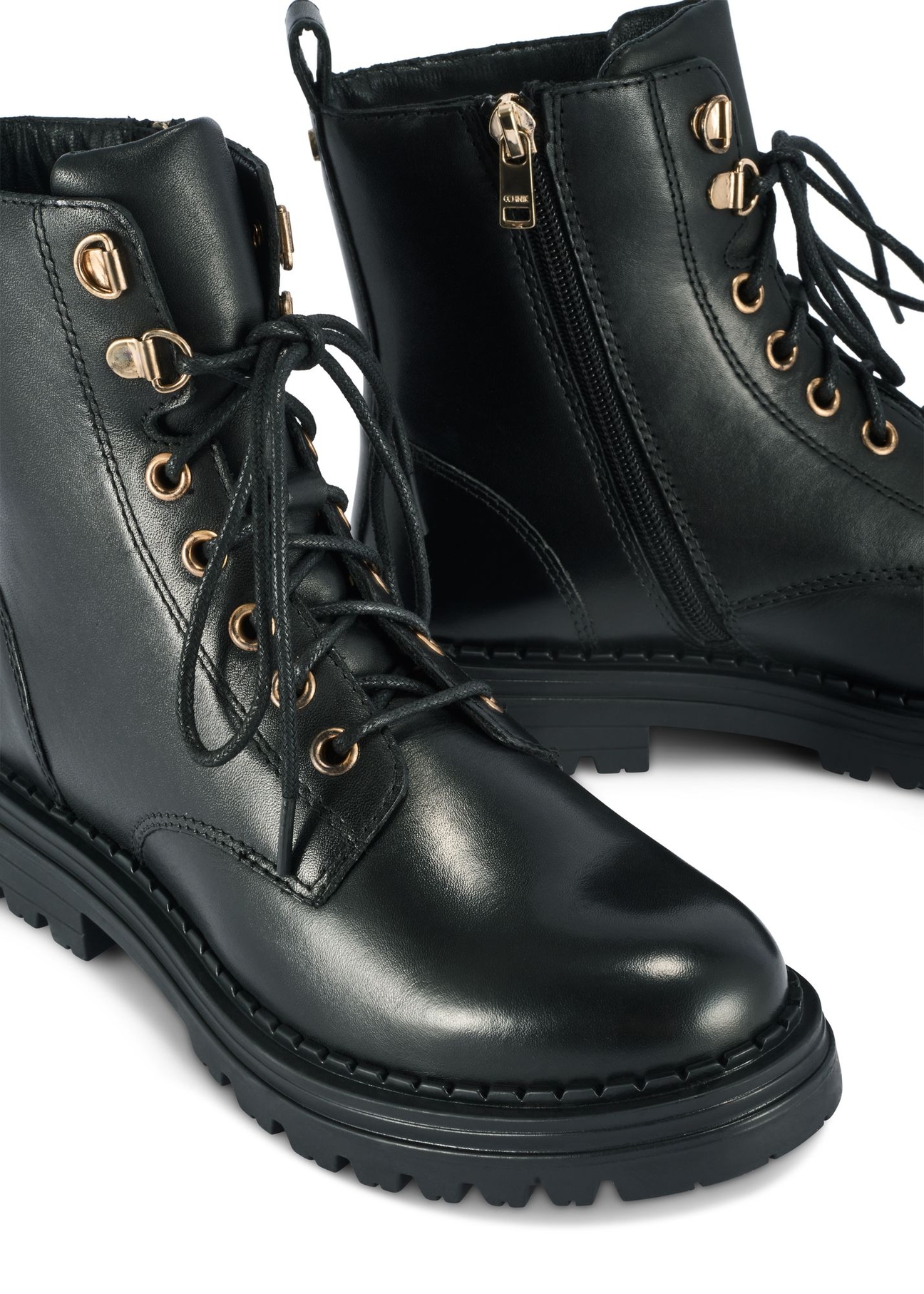 Black leather women's ankle boots BUTYD-1015A-99(Z25) - close-up of the detail on a white background.