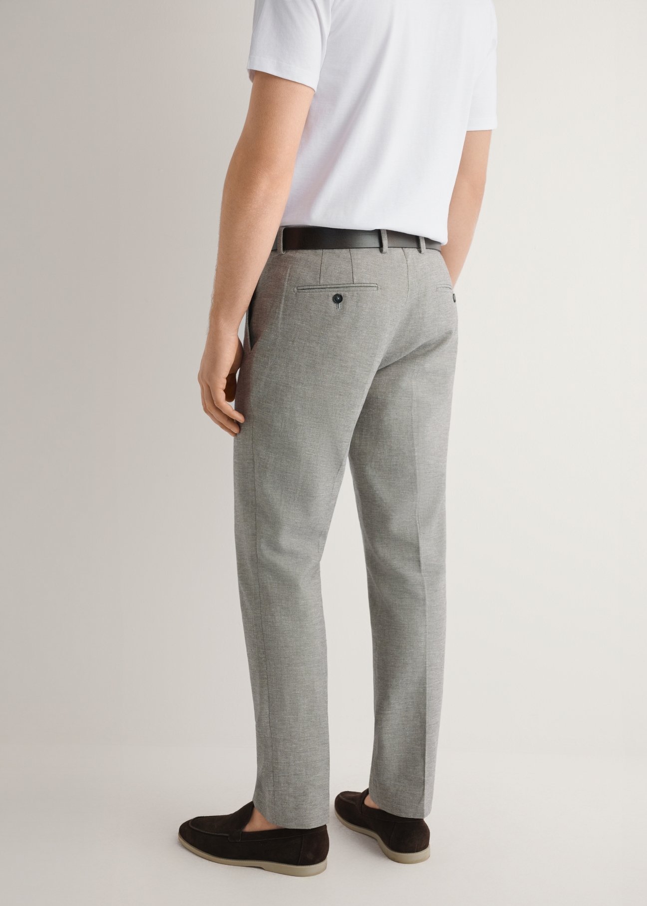 Beige men's suit trousers SPOMT-0098-1B(W26), product view from the back on the model. Half of the silhouette visible.