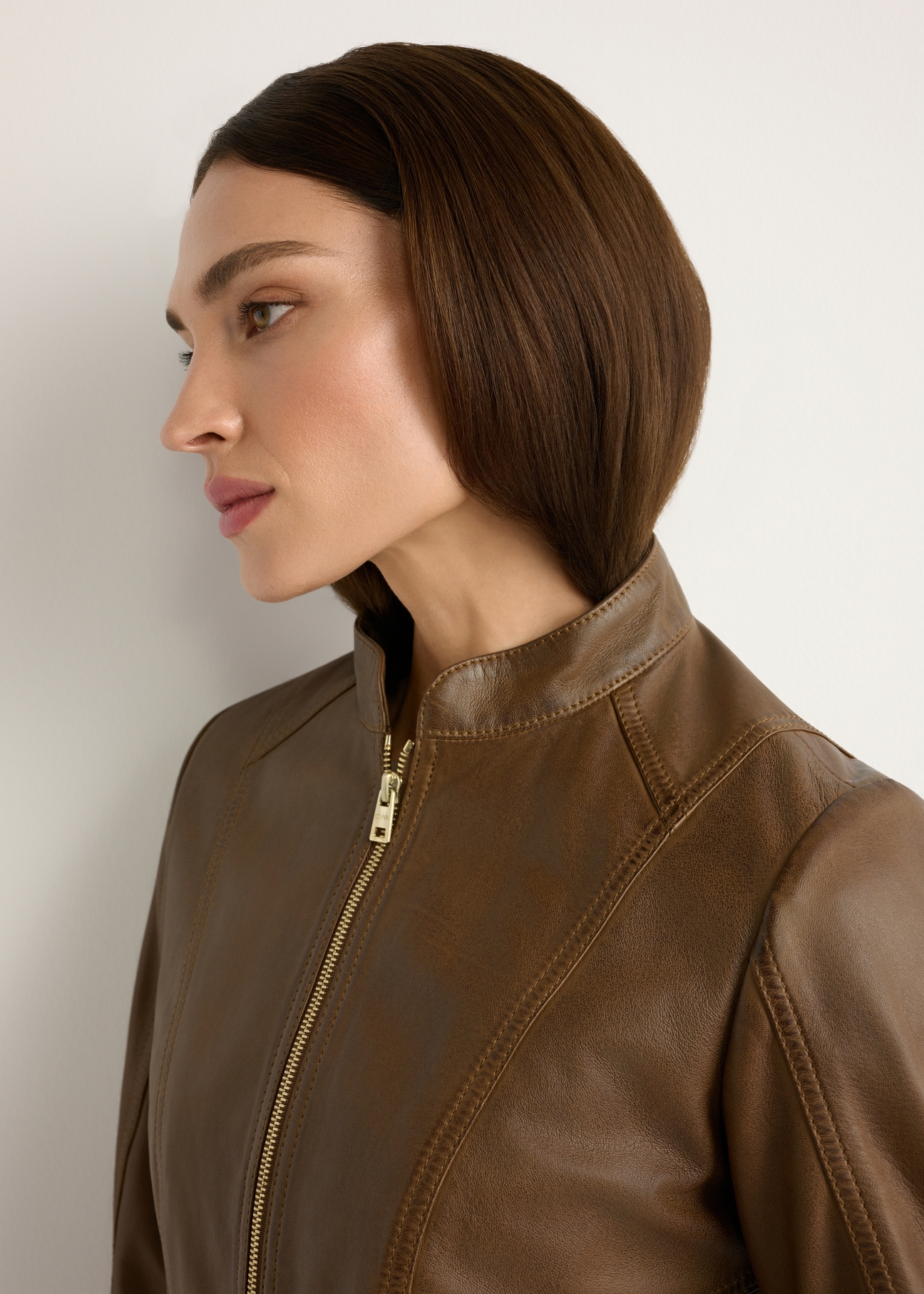 Women's brown leather jacket KURDS-0602-1F(W26), close-up of the product detail on the model.