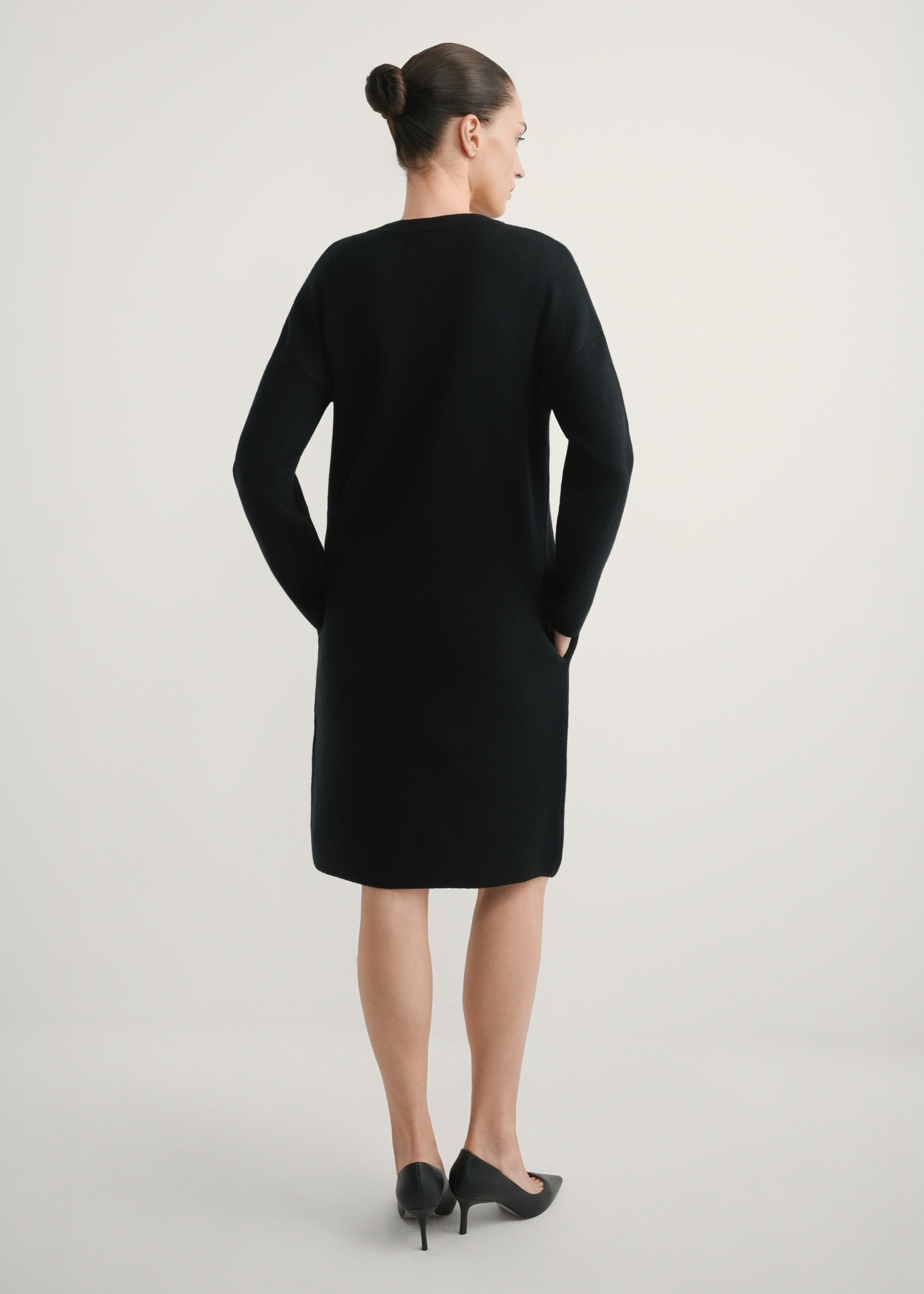 Black women's dress SUKDT-0260-99(W26), product view from the back, the model's entire silhouette is visible.