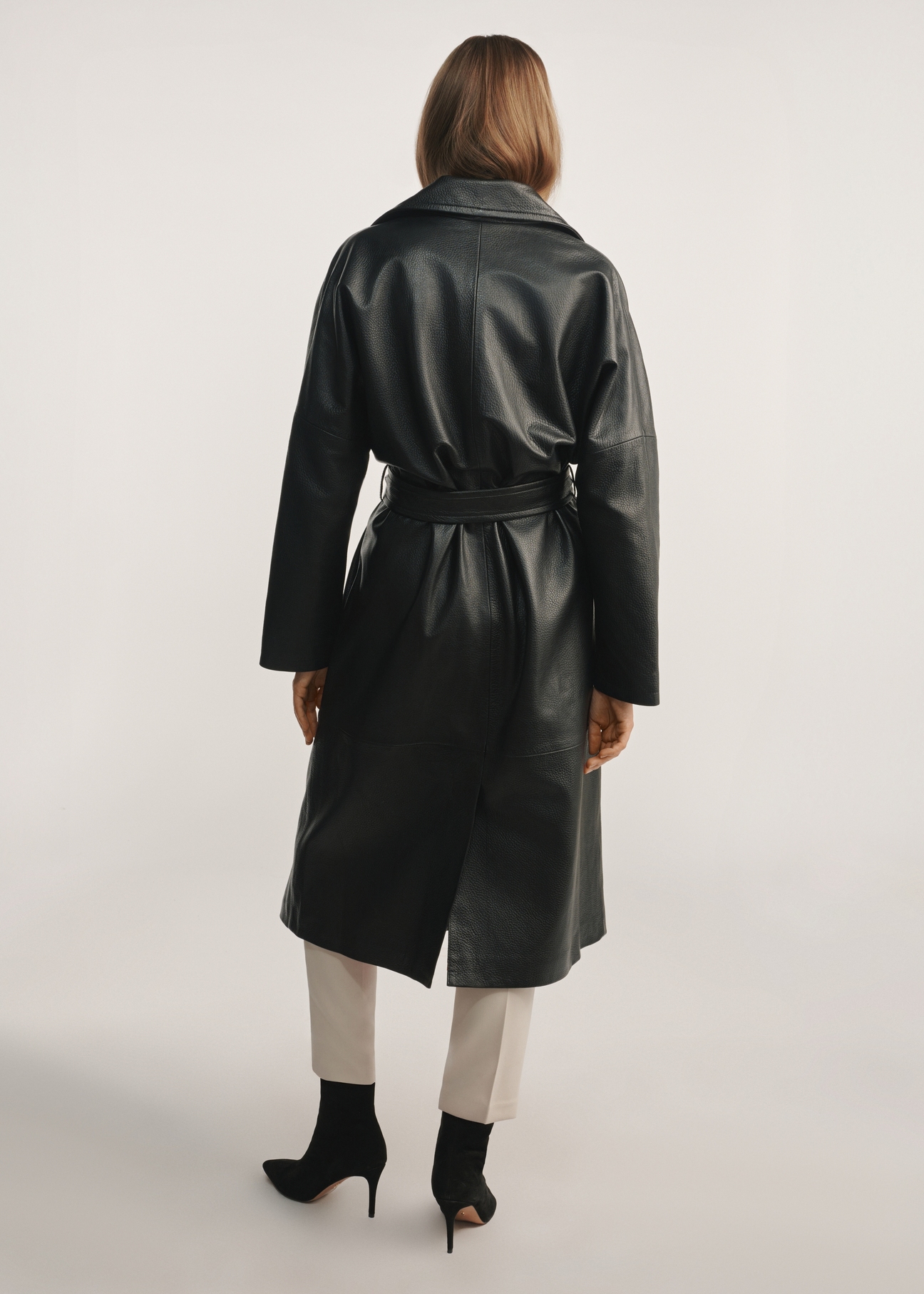 Women's black leather coat KURDS-0487-1192(Z25) - back view of the product on a model against a white background. Full body visible.