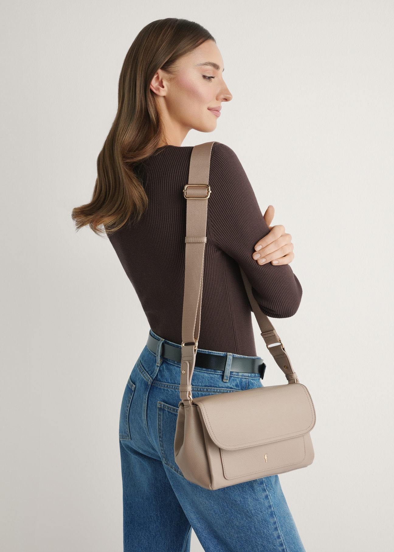 Beige classic women's handbag TOREC-1124-1D(W26) - front view of the product, on a model, against a light background. Knee-length silhouette visible.