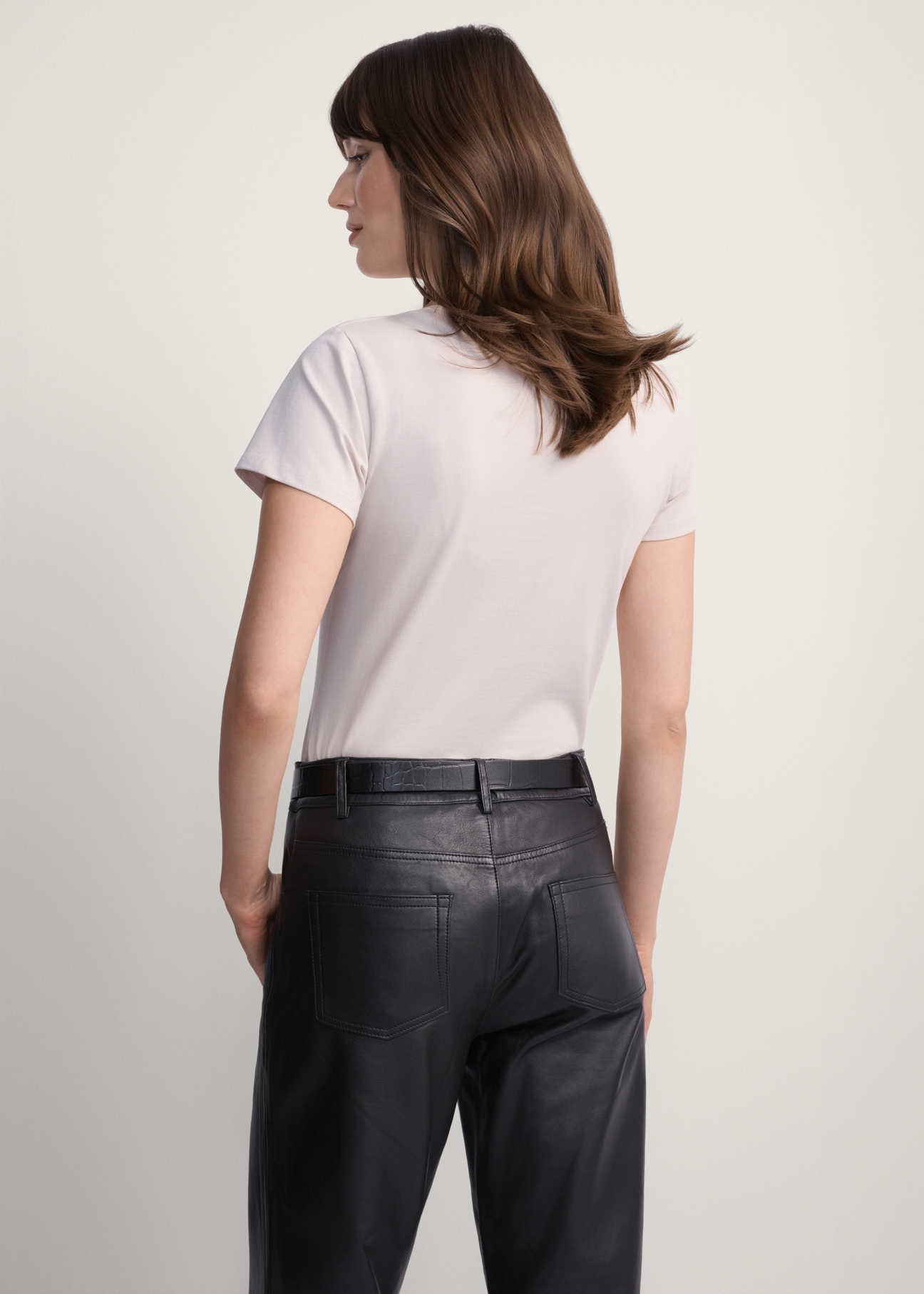 Beige women's basic T-shirt TSHDT-0111-81(KS), back view of the product on the model. Half of the silhouette visible.