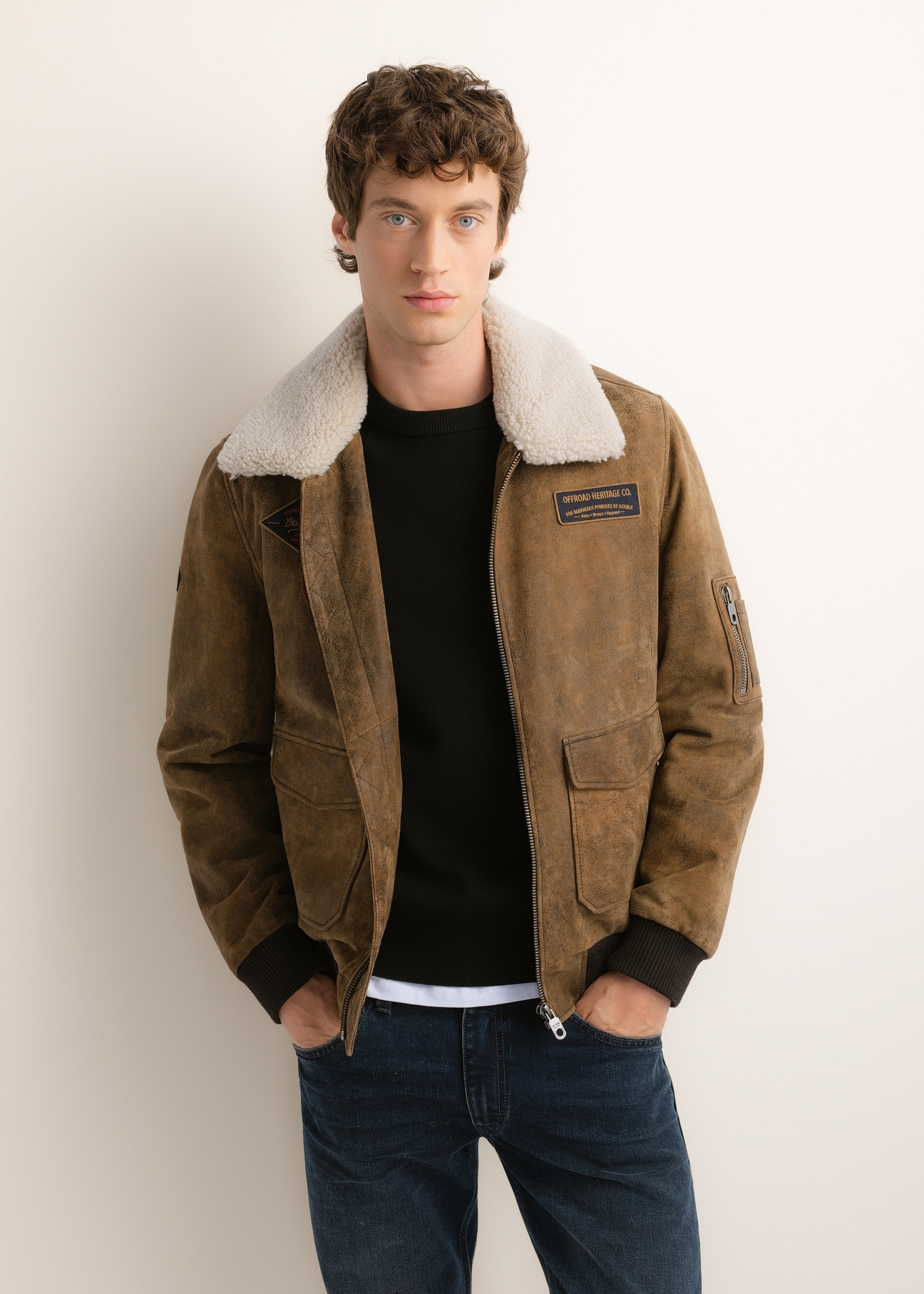 Men's suede bomber jacket KURMS-0422-1C(Z26), front product view on model. Half silhouette visible.