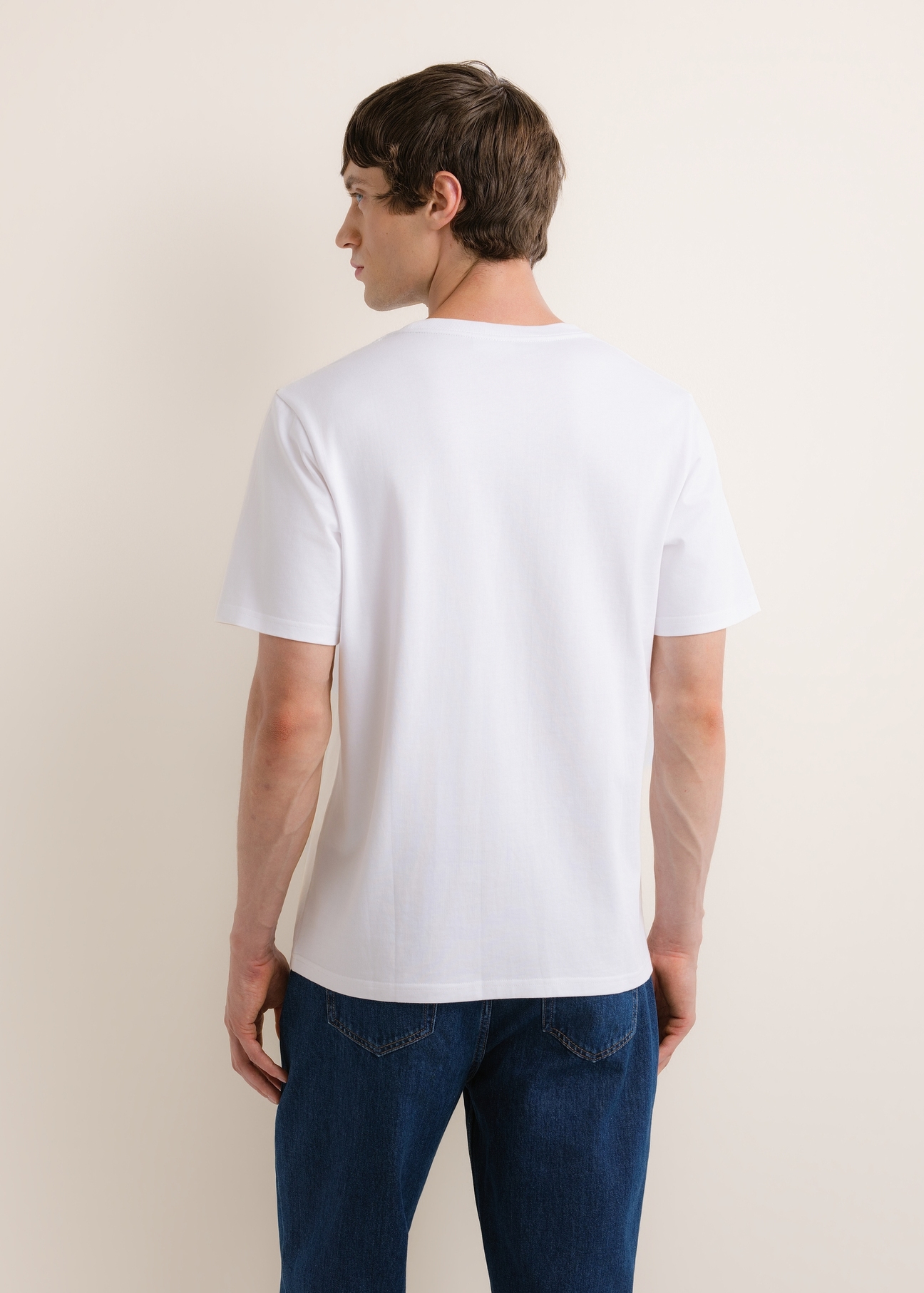 White cotton men's T-shirt TSHMT-0161-0A(Z26), back view of the product on the model. Half of the silhouette visible.