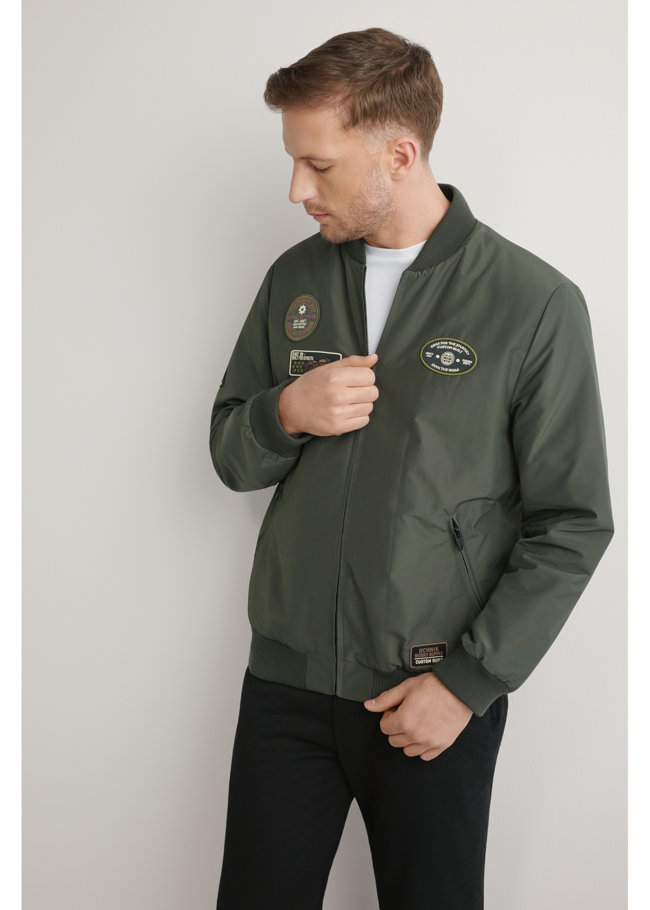 Men's khaki bomber jacket KURMT-0413A-8D(W26) - front product view on a light background. Half of the silhouette visible.
