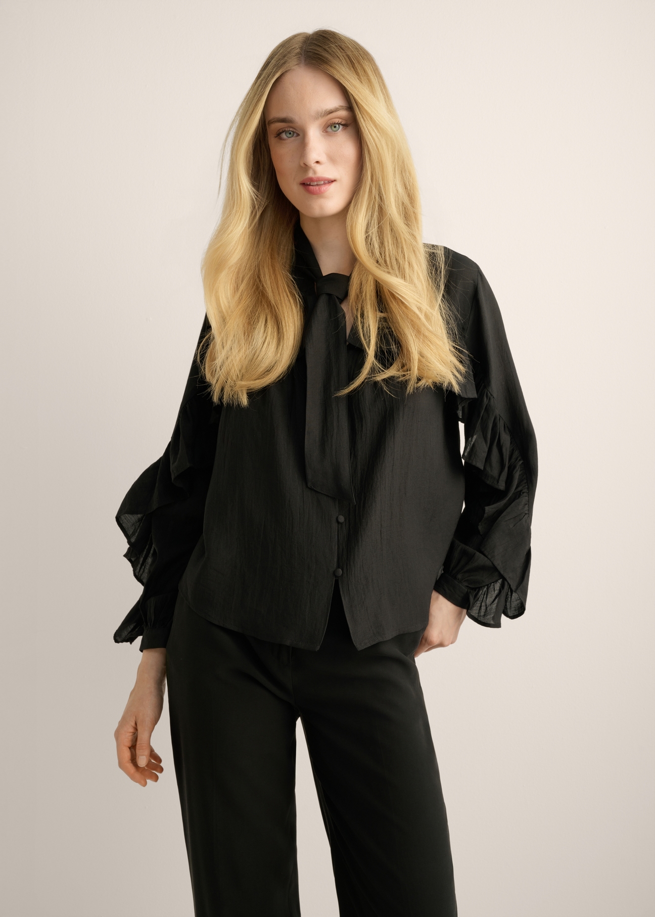Black women's shirt KOSDT-0192-99(Z26). Front view of the product on a model, showing half of the figure. 