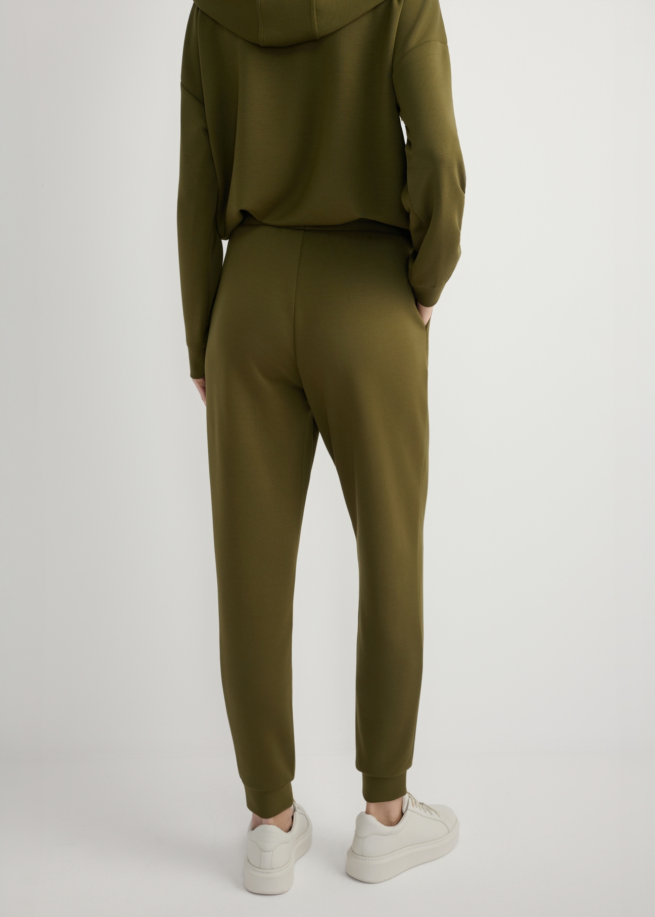 Women's khaki trousers SPODT-0108-8D(W26), back view of the product on the model. Half of the silhouette visible.
