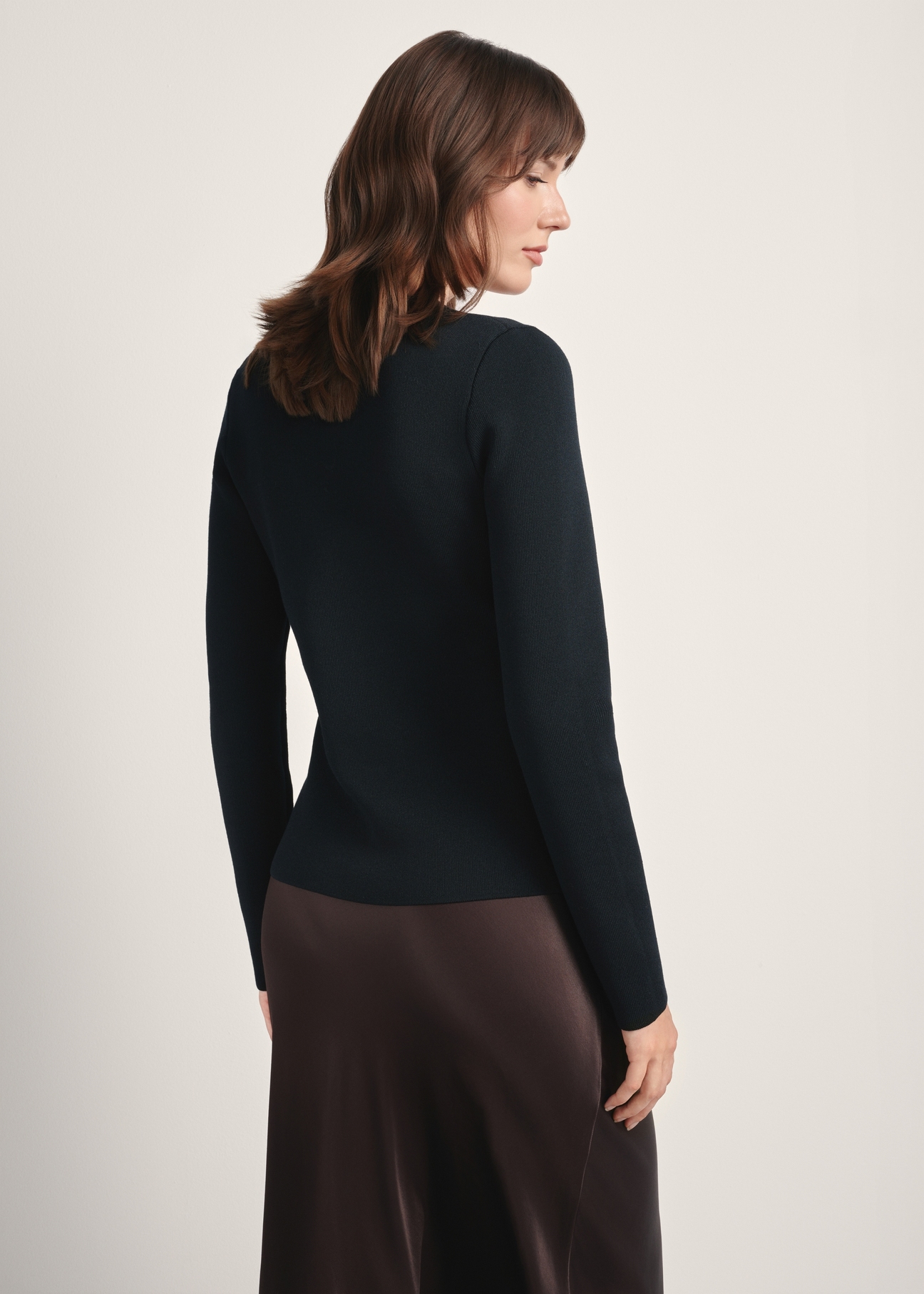 Women's black viscose and nylon cardigan KARDT-0056-99(Z25), back view of the product on the model. Half of the silhouette visible.