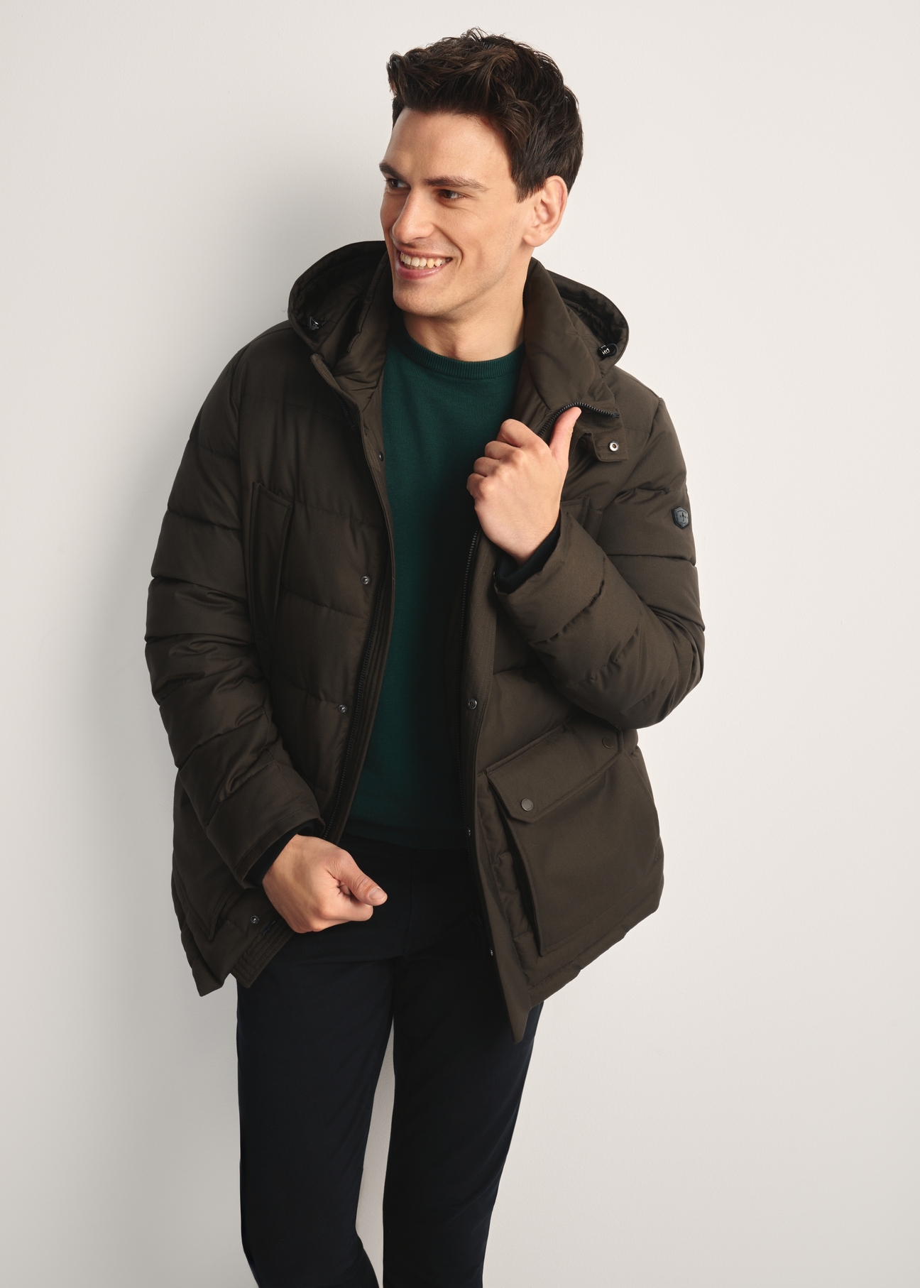 Men's olive winter jacket KURMT-0379-57(Z25) - front product view on model on white background. Knee-length silhouette visible.