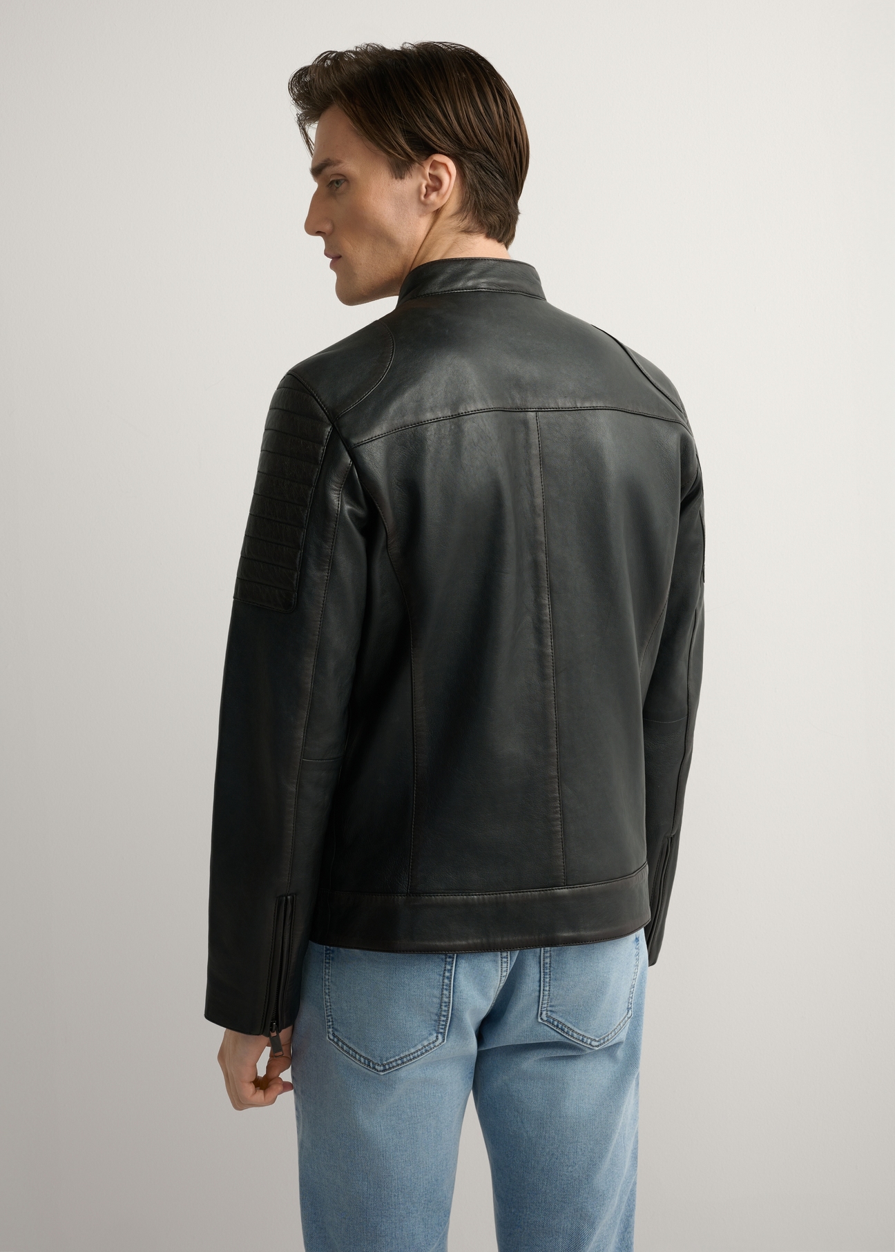 Black men's leather jacket KURMS-0394-99(W26), product view from the back on the model, half of the silhouette visible.