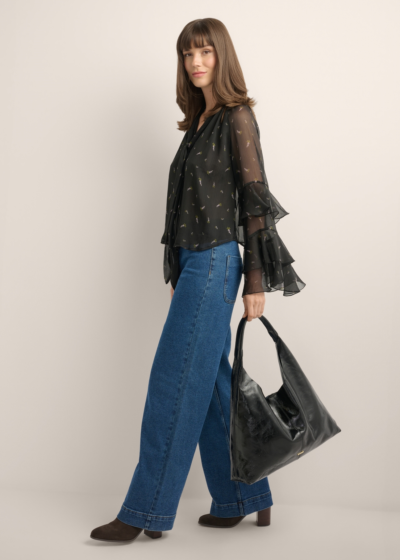 Large black leather women's handbag TORES-1179-9F(Z26), front view of the product on a model. Full body visible.