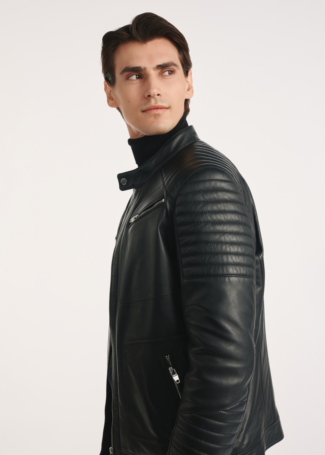 Black men's leather jacket KURMS-0382-1283(Z25), product visible from the side on the model, half of the silhouette visible.
