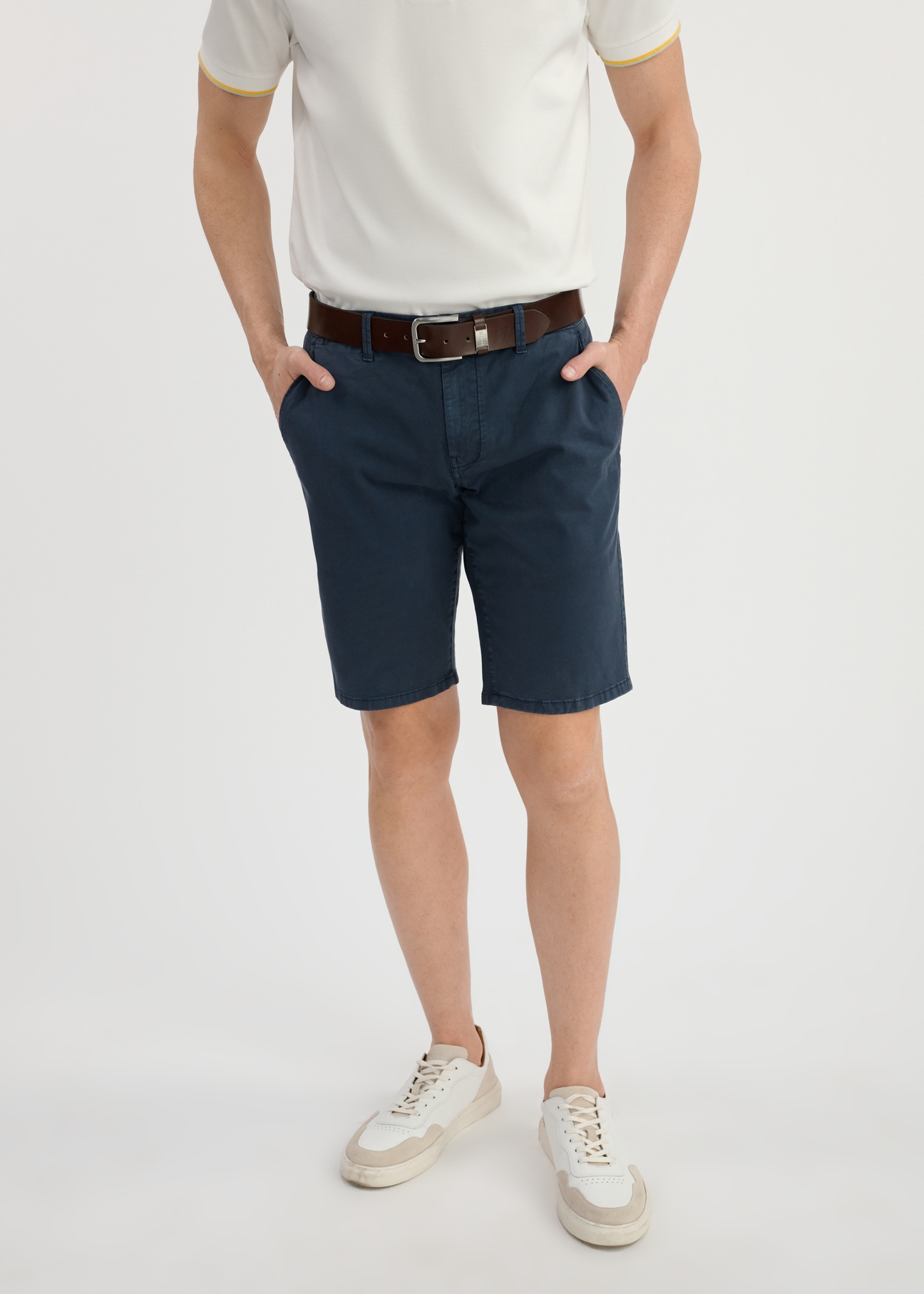 Navy blue men's shorts SZOMT-0029-69(W25) - front view on a model on a white background. Half of the silhouette visible.