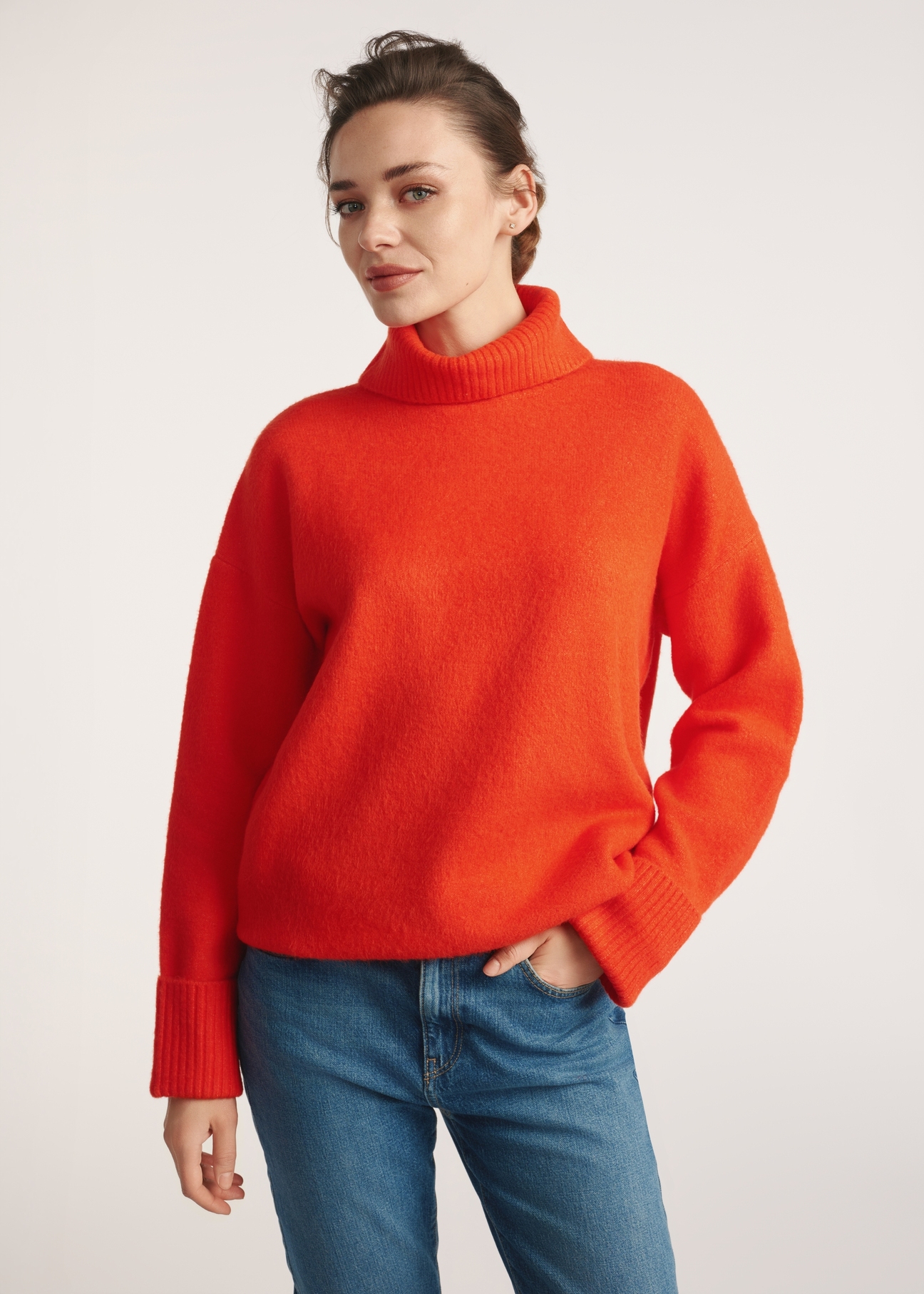 Orange women's turtleneck SWEDT-0249-30(Z25), front view of the product on the model. Half of the silhouette visible.