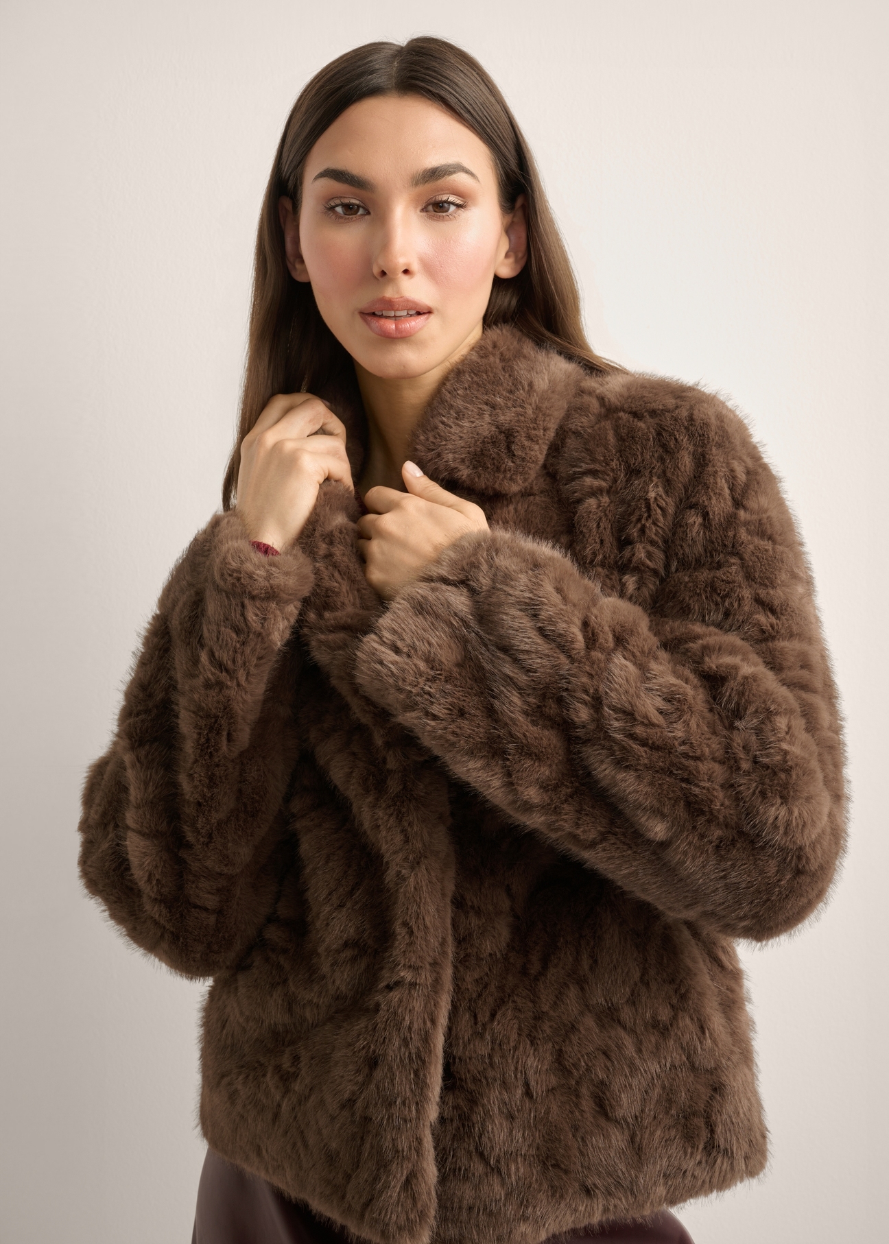 Women's brown short fur coat FUTDP-0058-1H(Z26), front view of the product on the model. Half of the silhouette visible.