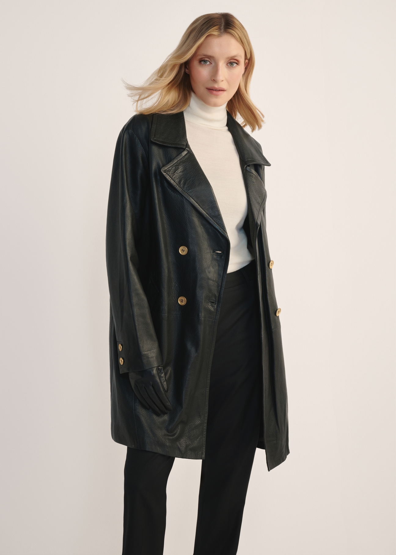 Women's leather jacket in the form of a coat KURDS-0443-1313(Z25), product view from the front on the model, half of the silhouette visible.