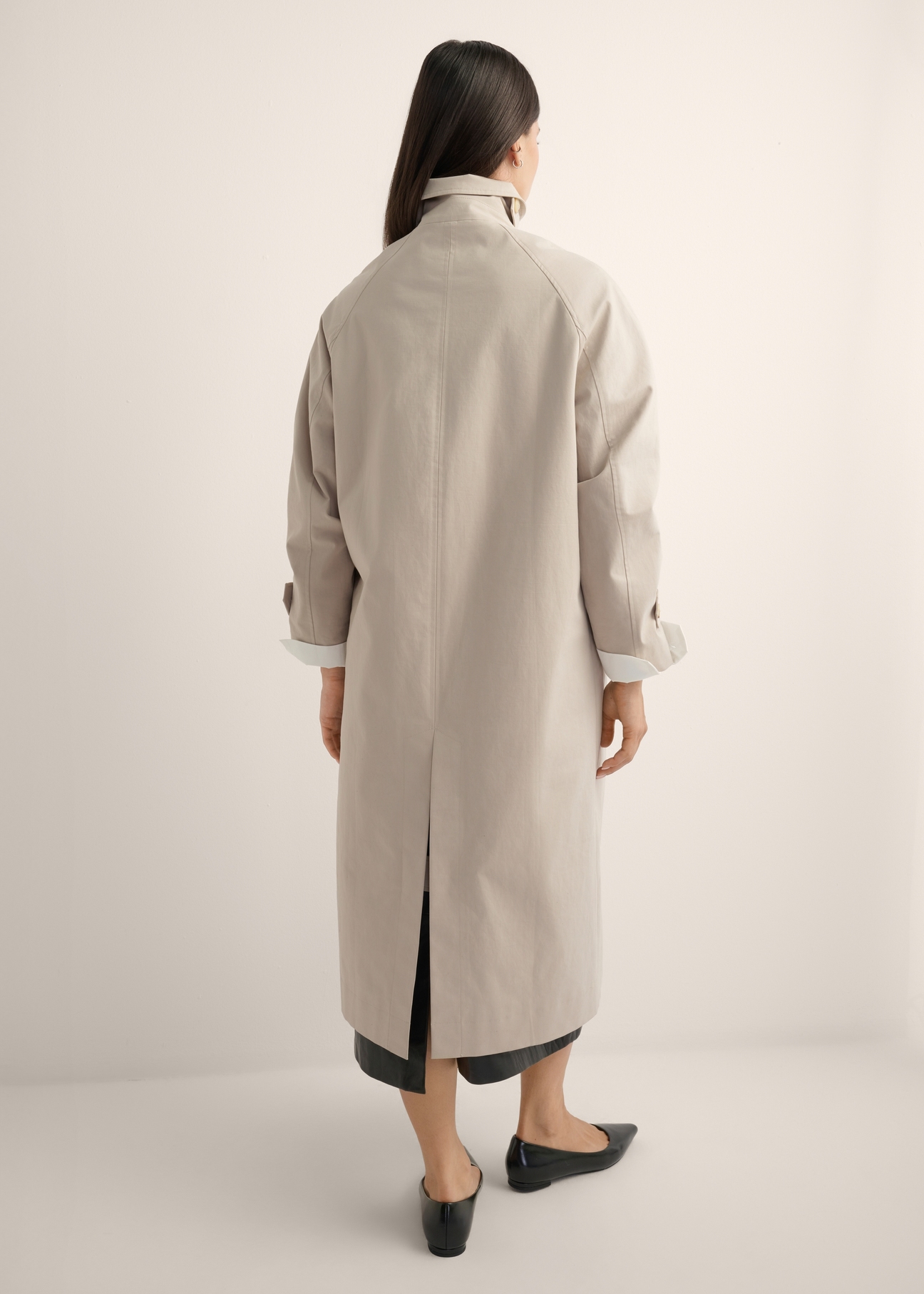 Long beige women's coat KURDT-0692-1J(Z26), product view from the back on the model, the whole silhouette is visible.