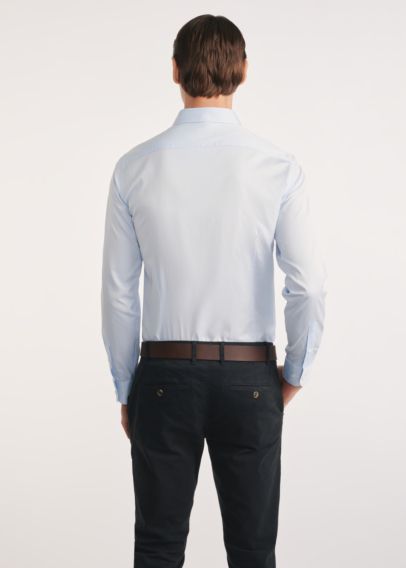 Light blue men's shirt KOSMT-0352-62(Z25), product view from the back on the model, half of the silhouette visible.