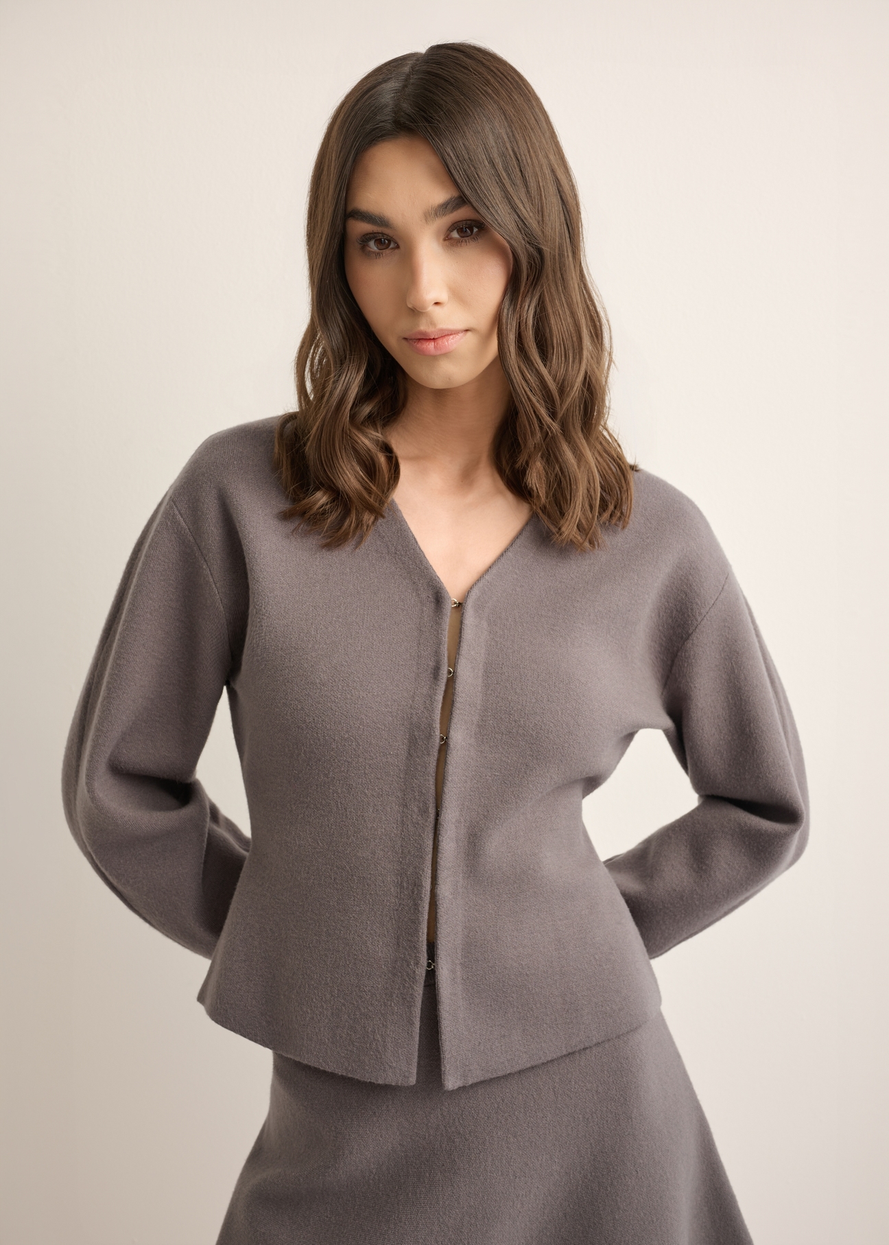 Graphite knitted women's cardigan KARDT-0066-9D(Z26), front view of the product on the model, half of the silhouette visible.