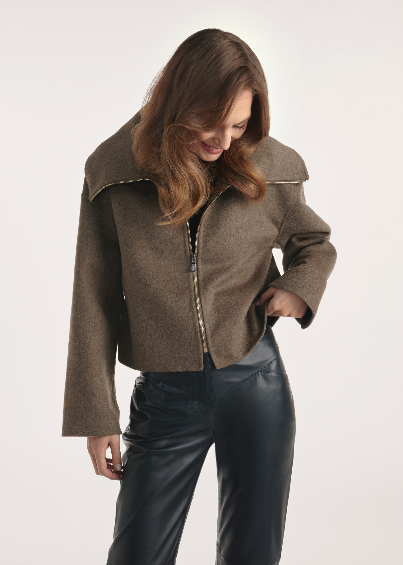 Short women's coat in brown color PLADT-0066-89(Z25), front view of the product on the model, half of the silhouette visible.-02