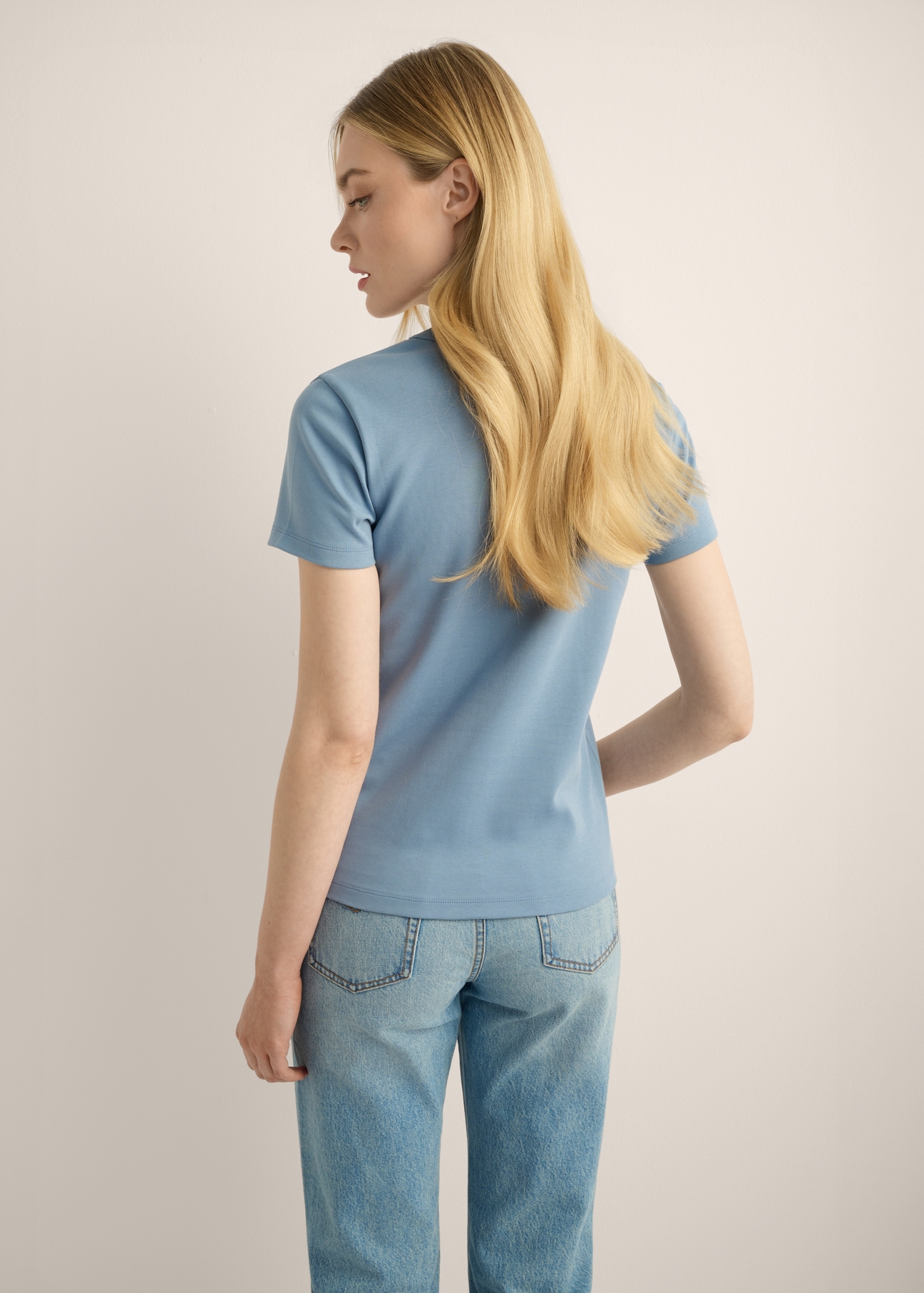 Blue cotton women's T-shirt TSHDT-0144-7B(Z26). Back view of the product on a model. Half of the figure is visible.