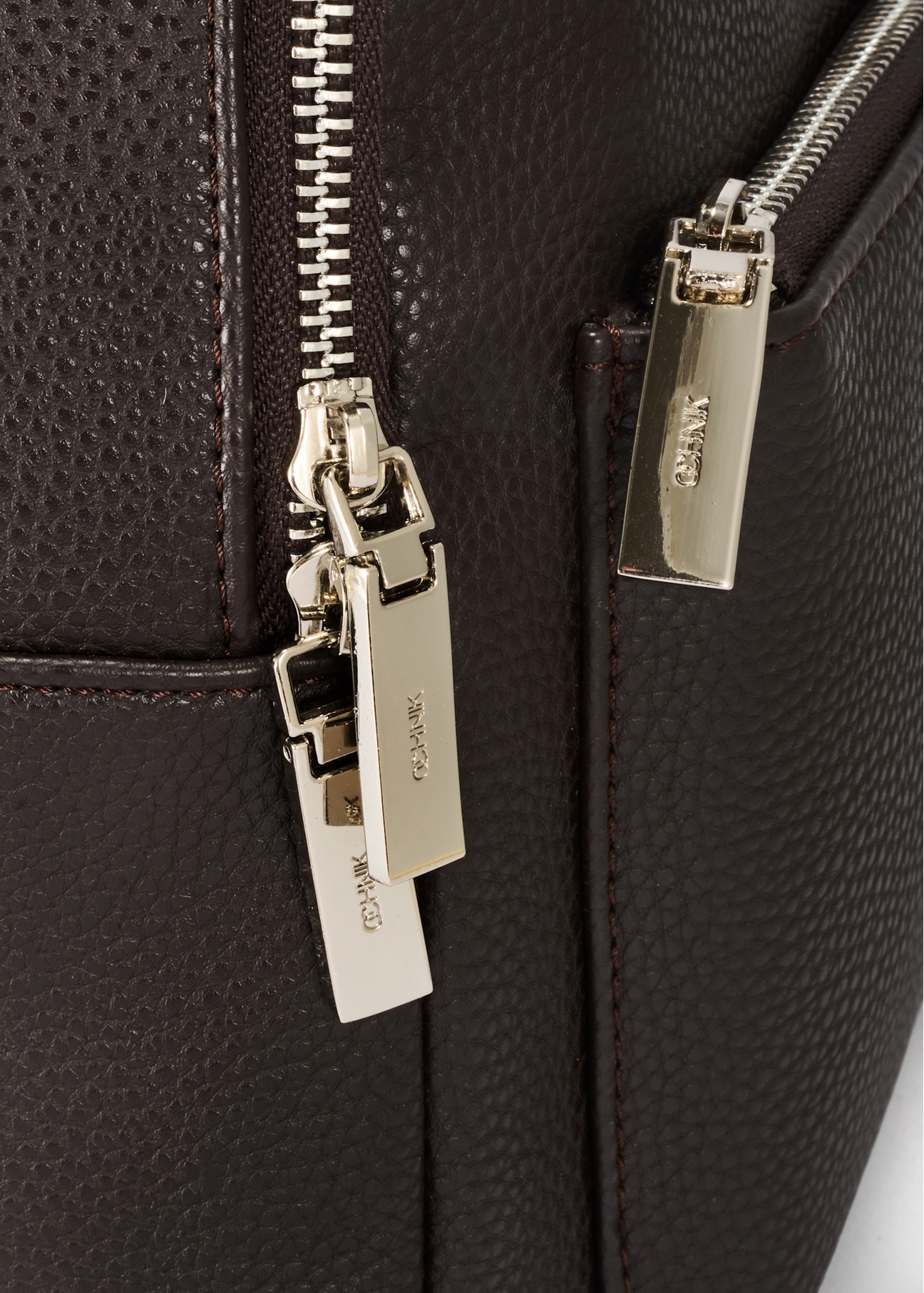 Dark brown women's backpack TOREC-0996A-89(Z25), close-up of product detail, view on white background.