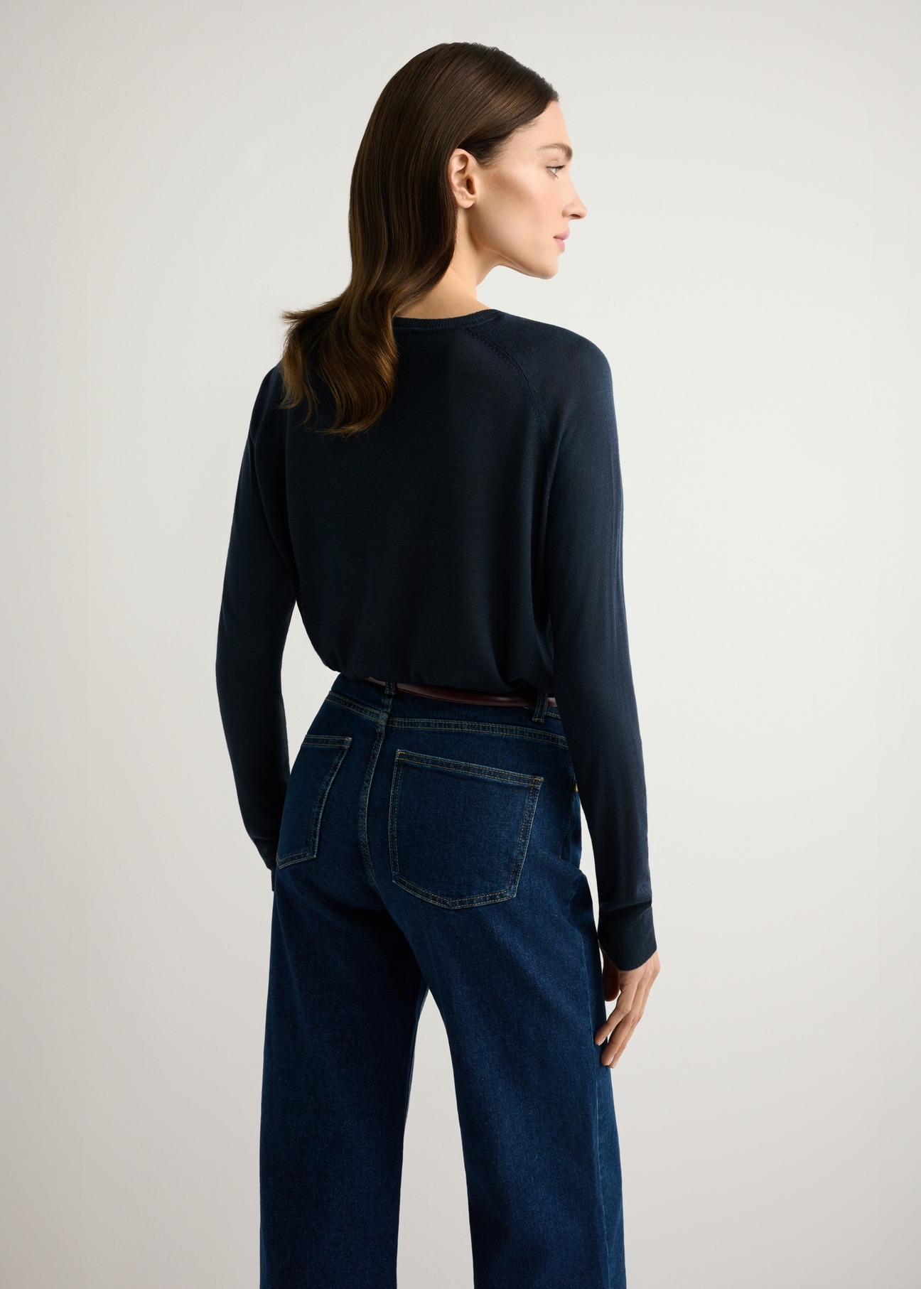 Thin navy blue women's sweater SWEDT-0257-7E(W26), product view from the back on the model, half of the silhouette visible.