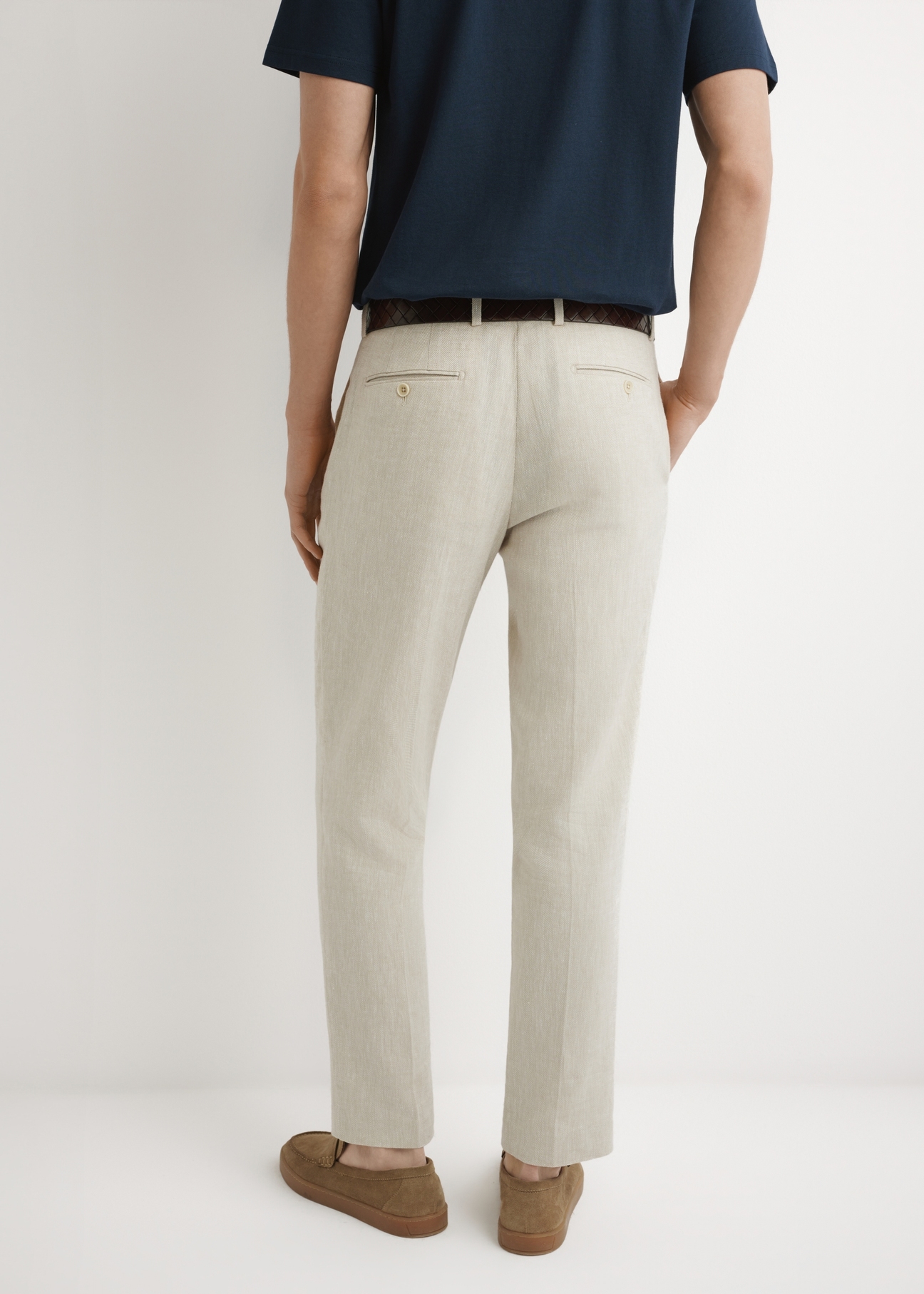 Men's beige herringbone suit trousers SPOMT-0117-1B(W26), product view from the back on the model. Half of the silhouette visible.