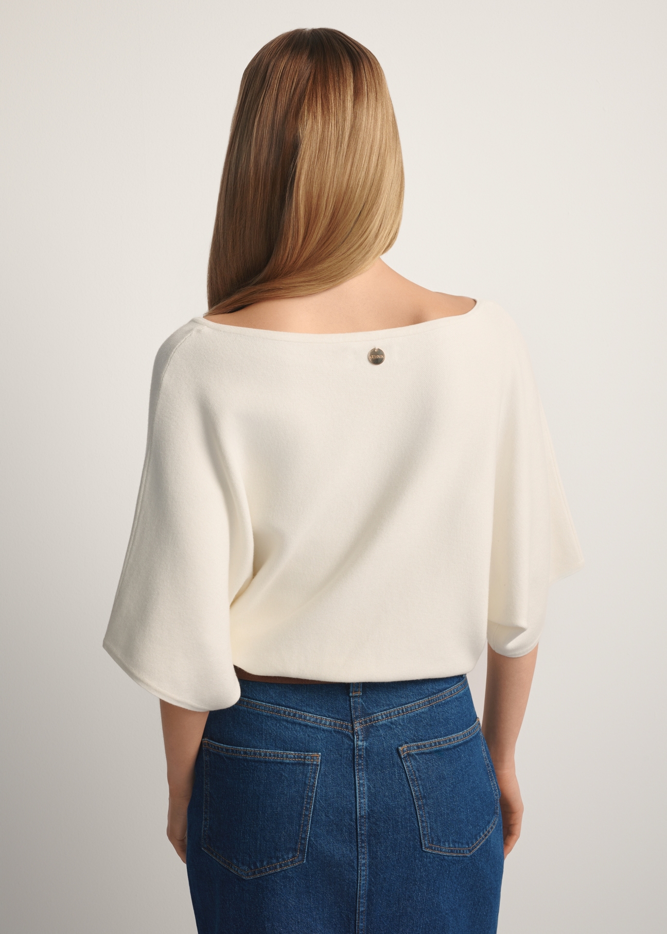 Women's white blouse BLUDT-0201-0B(W26), back view of the product on the model. Half of the silhouette visible.