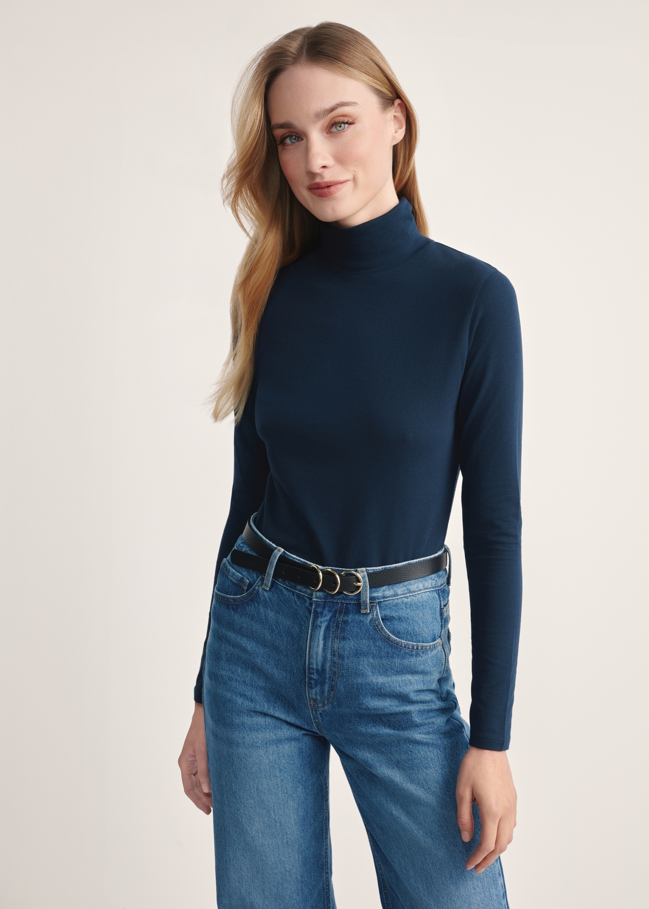Navy blue women's turtleneck blouse LSLDT-0040-68(Z25), product visible from the front on the model, half of the silhouette visible.