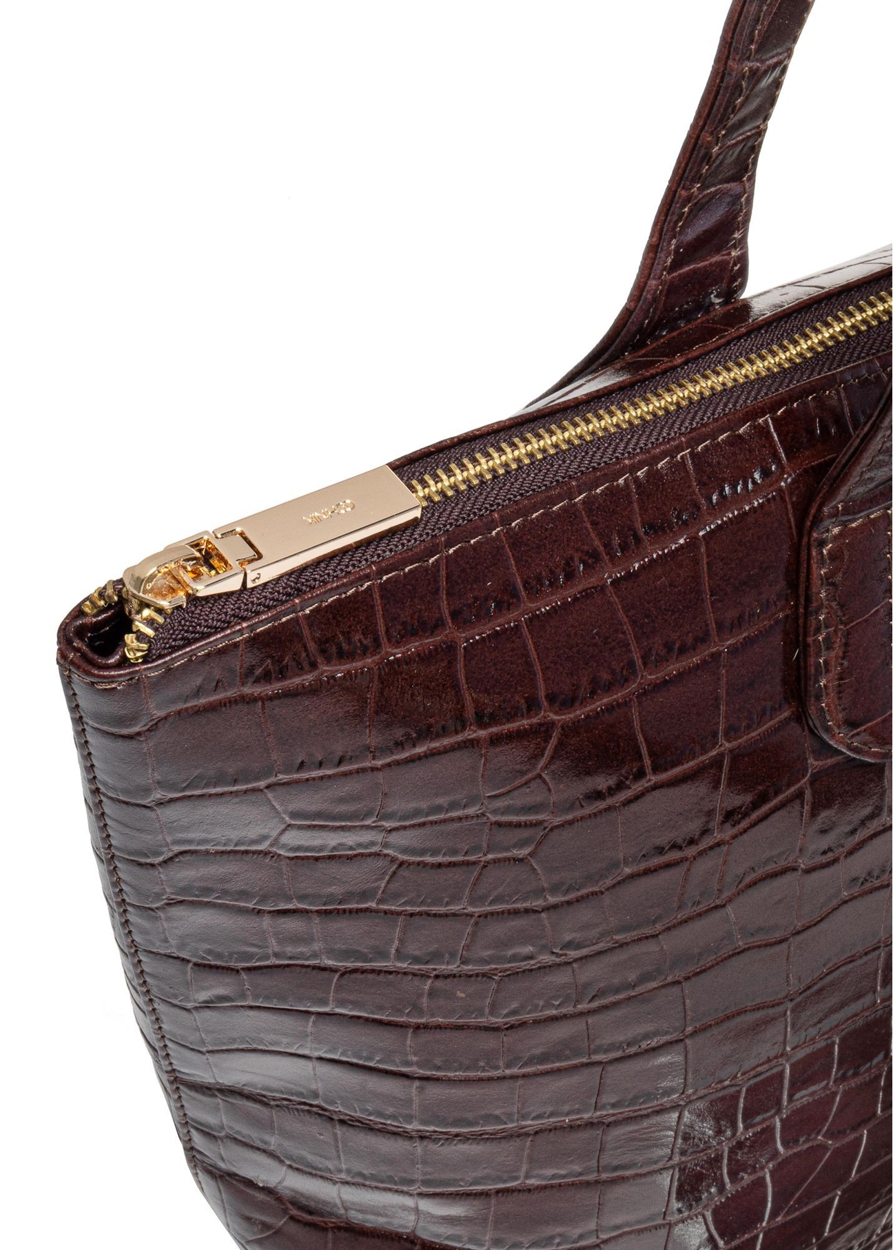 Women's brown leather shopper bag TORES-0939E-89(Z25) - close-up of detail on white background. Visible zipper.