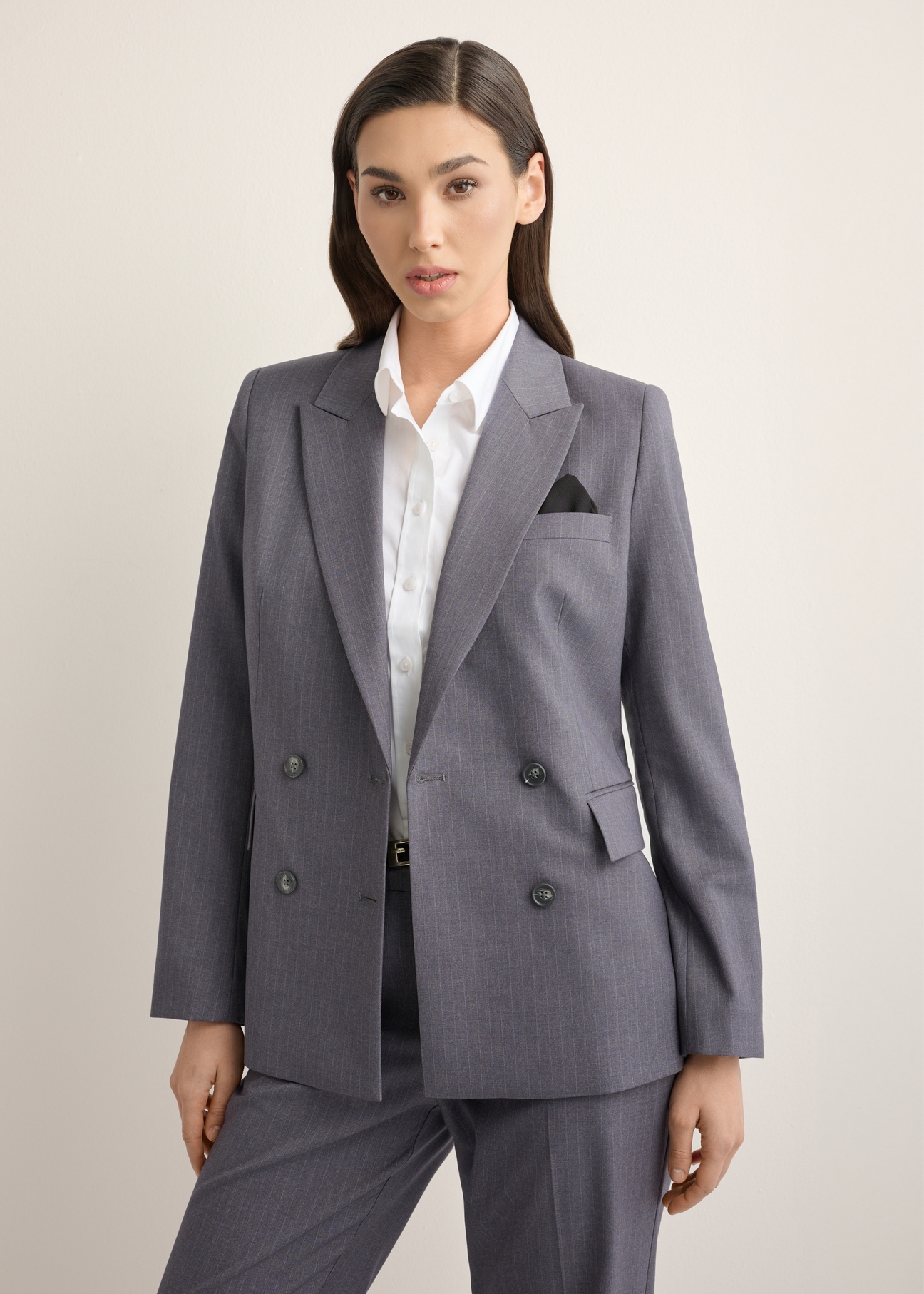 Women's gray blazer ZAKDT-0050-9D(Z26), front view of the product on the model. Half of the silhouette visible.