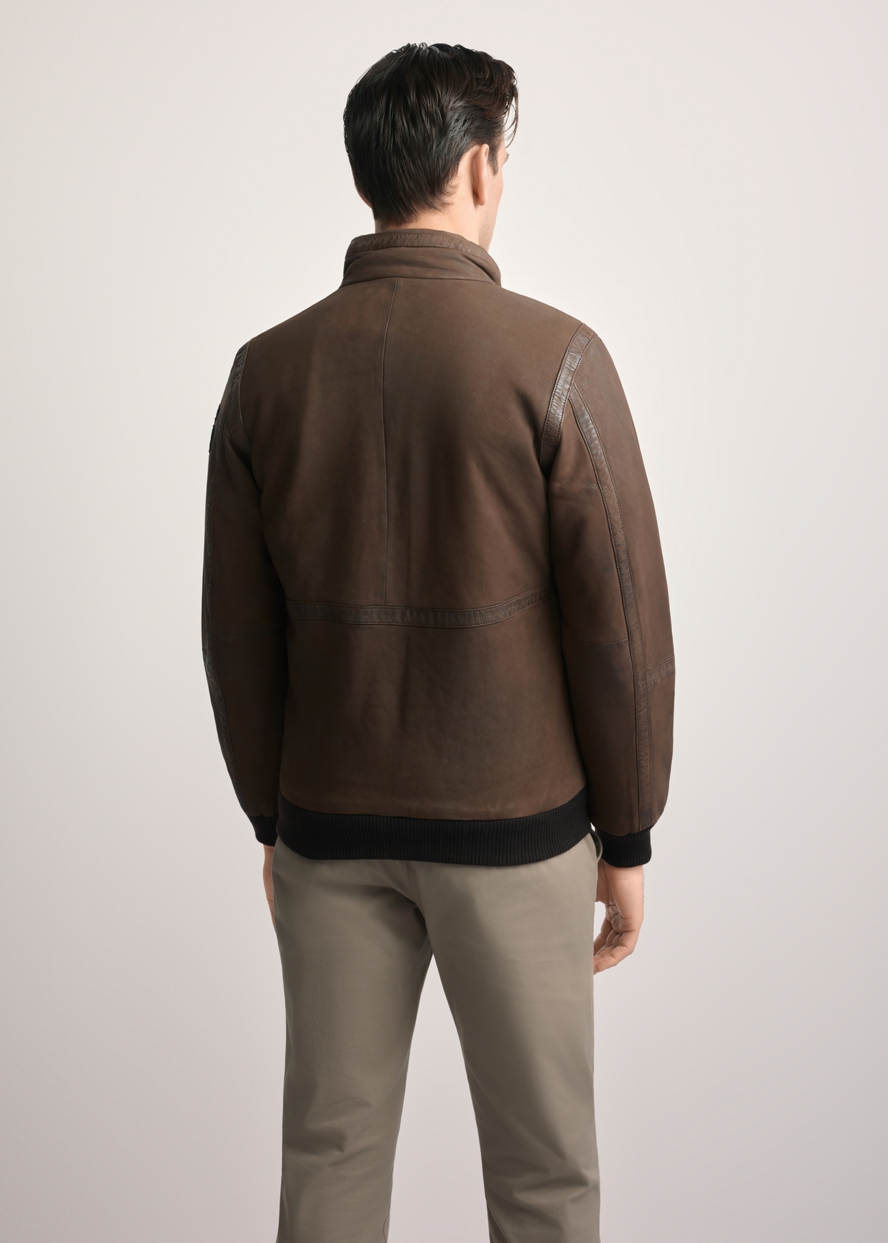 Men's brown leather jacket KURMS-0383-2876(Z25), product view from the back on the model. Half of the silhouette visible.