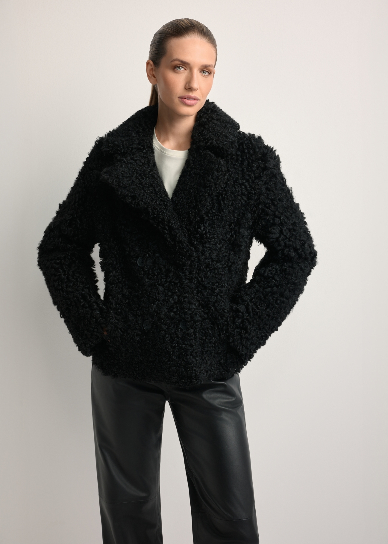 Women's black sheepskin coat KOZDS-0087-3095(Z25), front view of the product on the model. Half of the silhouette visible.