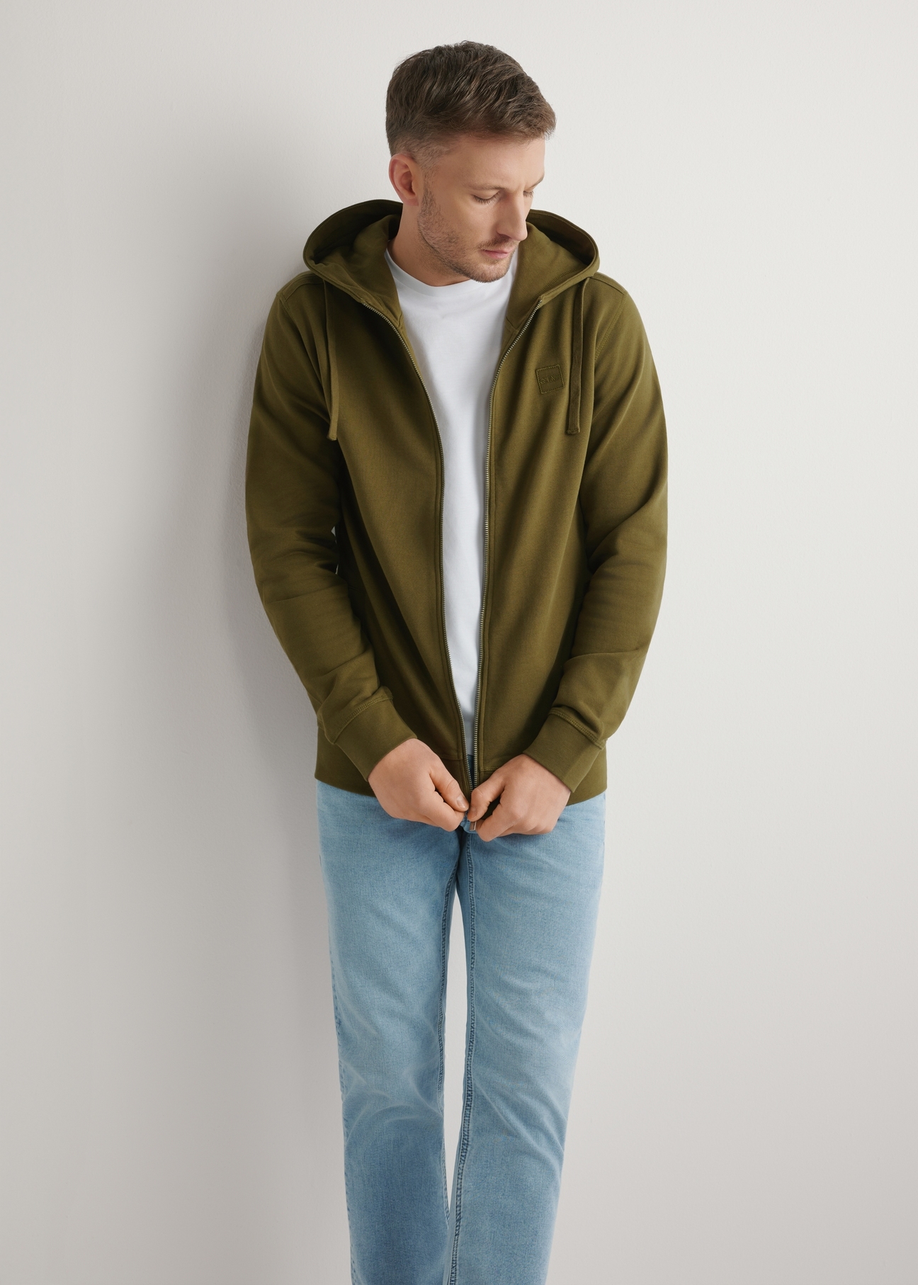 Men's Khaki Zip-Up Sweatshirt BLZMT-0078-8D(W26), front view of the product on the model. Half of the silhouette visible.
